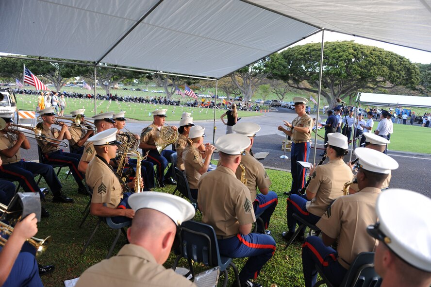 HONOLULU - The Marine Corps Forces Pacific Band plays as military veterans, motorcycle clubs and  Vietnam veteran supporters gathered at the National Cemetery of the Pacific in the Pu'owaina Crater, also known as the Punchbowl for a Vietnam Veteran Ceremony and wreath laying ceremony on May 30.  (U.S.  Air Force photo/Tech Sgt. Cohen A. Young)