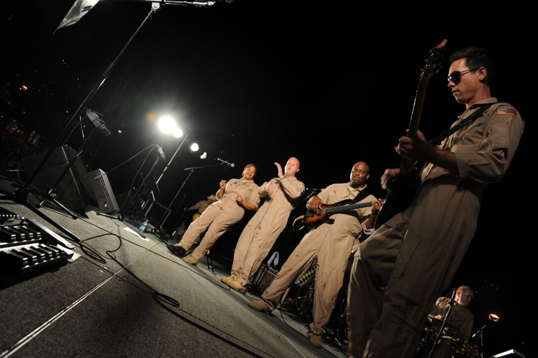 HONOLULU - Tech Sgt Tamiko Boone (left), Master Sgt. Ryan Carson, Tech Sgt. Terry Grace and Tech Sgt. Johnny Kukan of the U. S. Air Force Band of the Pacific - Hawaii, also known as "Hana Hou" perform in front of more than 400 onlookers during a Military Band Melee event at Ft DeRussy Park in Honolulu, Hawaii on May 29 as part of Military Appreciation Month and a prelude to Memorial Day events. The U.S. Army's 25th Infantry Division Band, the U. S. Navy Pacific Fleet Band, the Marine Corps Forces Pacific Band, the U.S. Air Force of the Band of the Pacific-Hawaii and the U.S. Coast Guard were all represented at the free concert. Sergeant Carson is assigned to the U.S. Air Force Band in Washing, D.C. (U.S.  Air Force photo/Tech Sgt. Cohen A. Young)