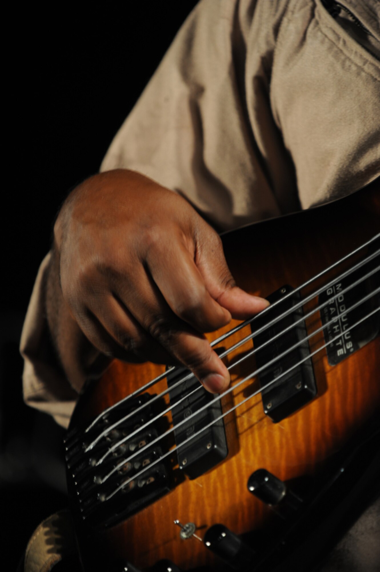 HONOLULU - Tech Sgt. Terry Grace of the U. S. Air Force Band of the Pacific - Hawaii, also known as "Hana Hou" strums his guitar during a Military Band Melee event at Ft DeRussy Park in Honolulu, Hawaii on May 29 as part of Military Appreciation Month and a prelude to Memorial Day events. The U.S. Army's 25th Infantry Division Band, the U. S. Navy Pacific Fleet Band, the Marine Corps Forces Pacific Band, the U.S. Air Force of the Band of the Pacific-Hawaii and the U.S. Coast Guard were all represented at the free concert.  (U.S.  Air Force photo/Tech Sgt. Cohen A. Young)