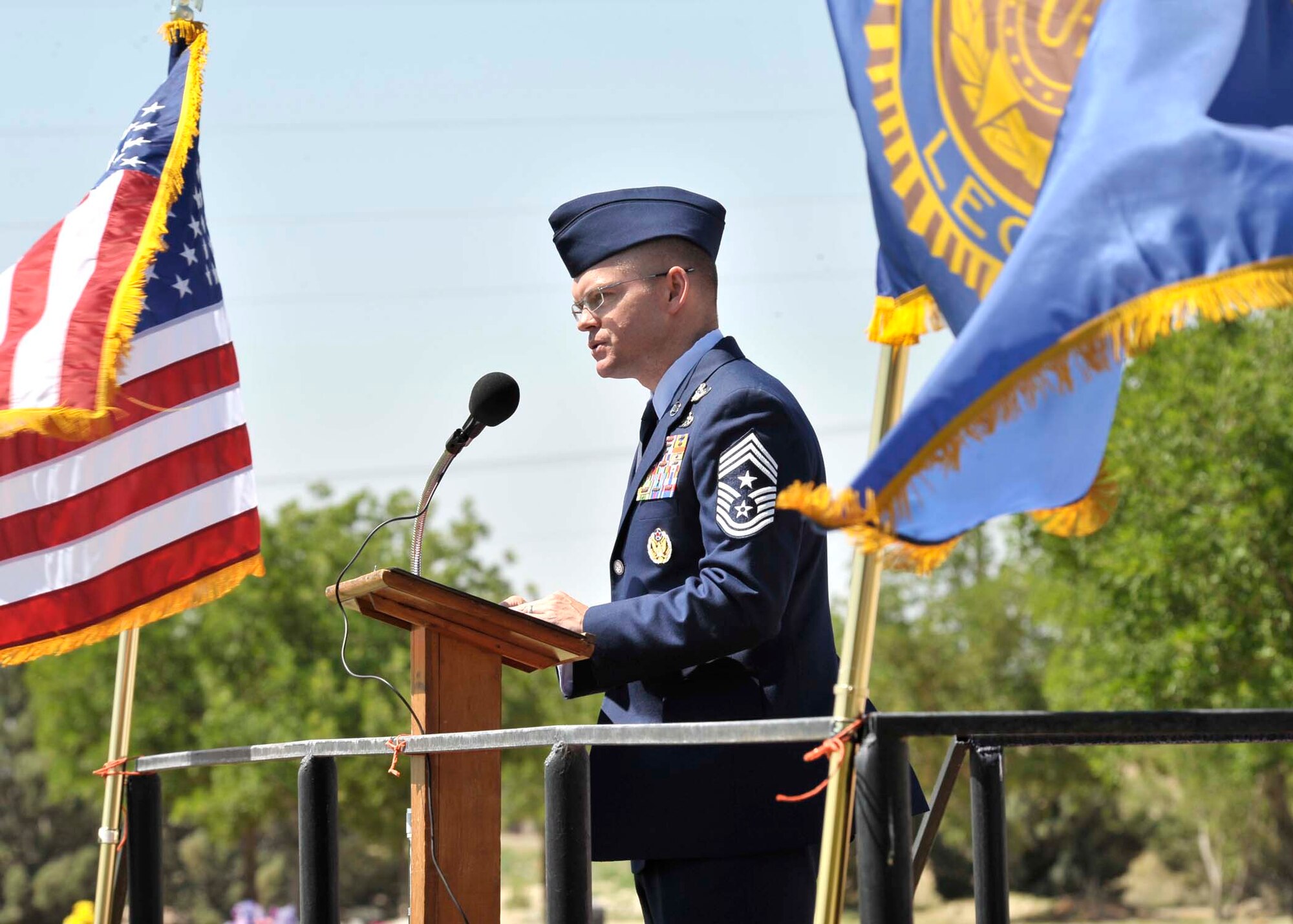 Chief Master Sgt. William Turner, 27th Special Operations Wing command chief, gives a speech at the 64th Annual American Legion Memorial Day Ceremony, May 31.  The ceremony also included a tribute to Portales Gold Star Mothers, Myrtie Smith and Lila Bryant, who both lost sons in the Vietnam War.  (U.S. Air Force photo by Staff Sgt. Heather R. Redman)
