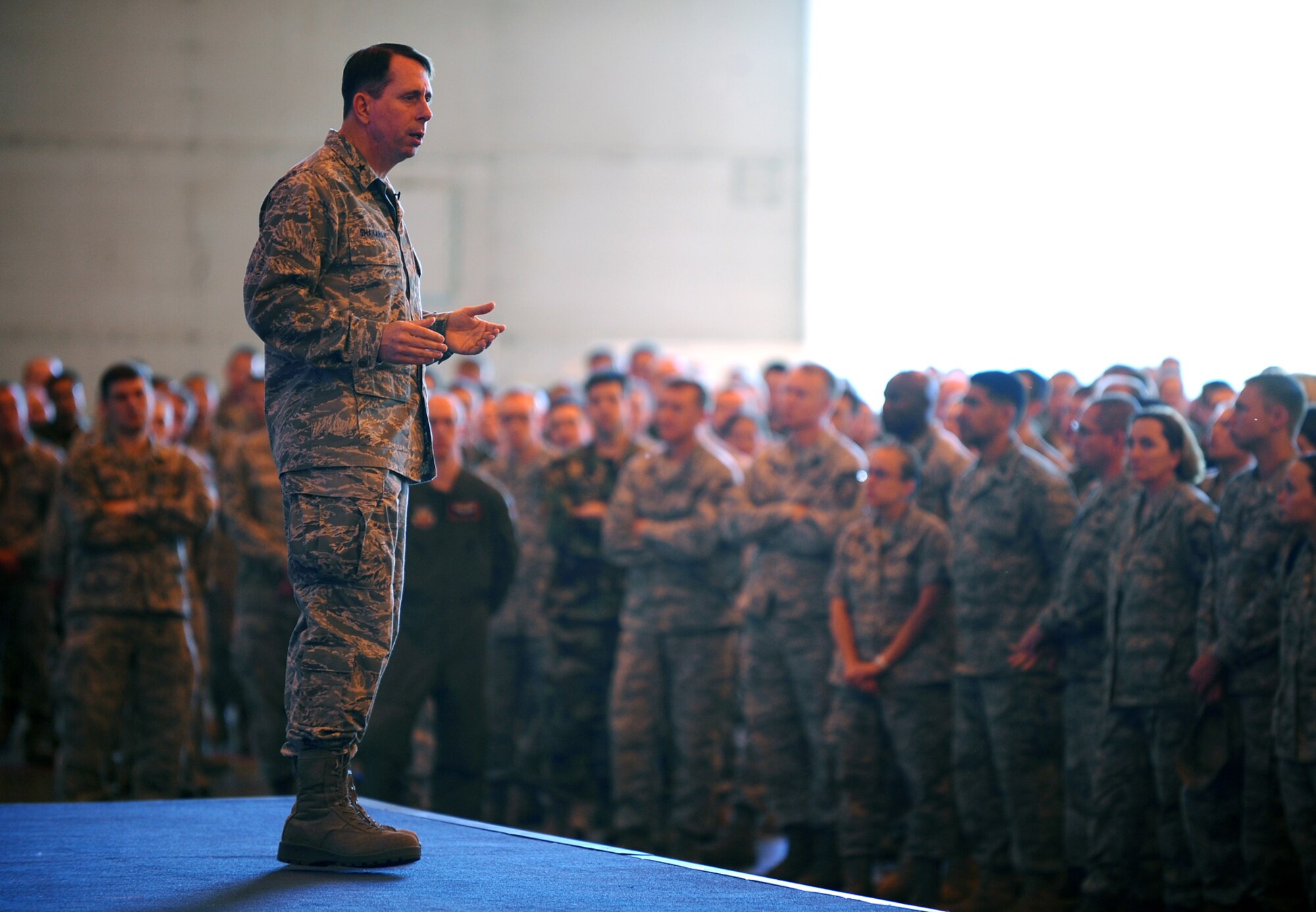 OFFUTT AIR FORCE BASE, Neb. -- Brig. Gen. John N.T. Shanahan, 55th Wing commander, gives a safety briefing to several hundred members of Team Offutt inside Dock One of the Bennie Davis Maintenance Facility here May 27.  The briefing kicked off the base's Critical Days of Summer Safety Campaign, as well as the Offutt's annual Safety Day. U.S. Air Force Photo by Josh Plueger