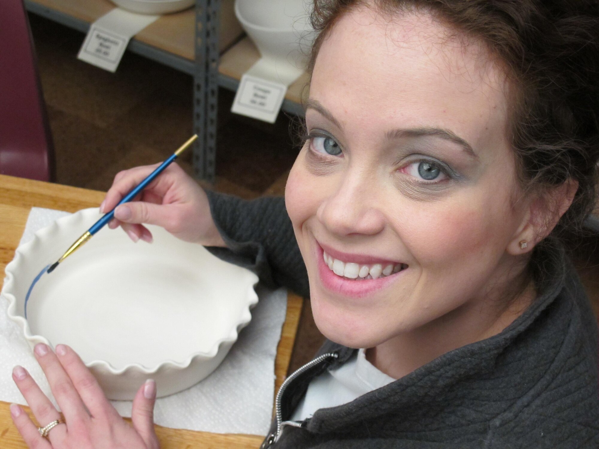 MINOT, N.D. -- 1st Lt. Kidron Farnell, 5th Bomb Wing deputy chief of public affairs, glazes a quiche dish at Margie's Art Glass studio here recently. The trip exposed Lieutenant Farnell to the different ceramic and glass offerings available in the local Minot area. (U.S. Air Force photo by 1st Lt. John B. Farnell)