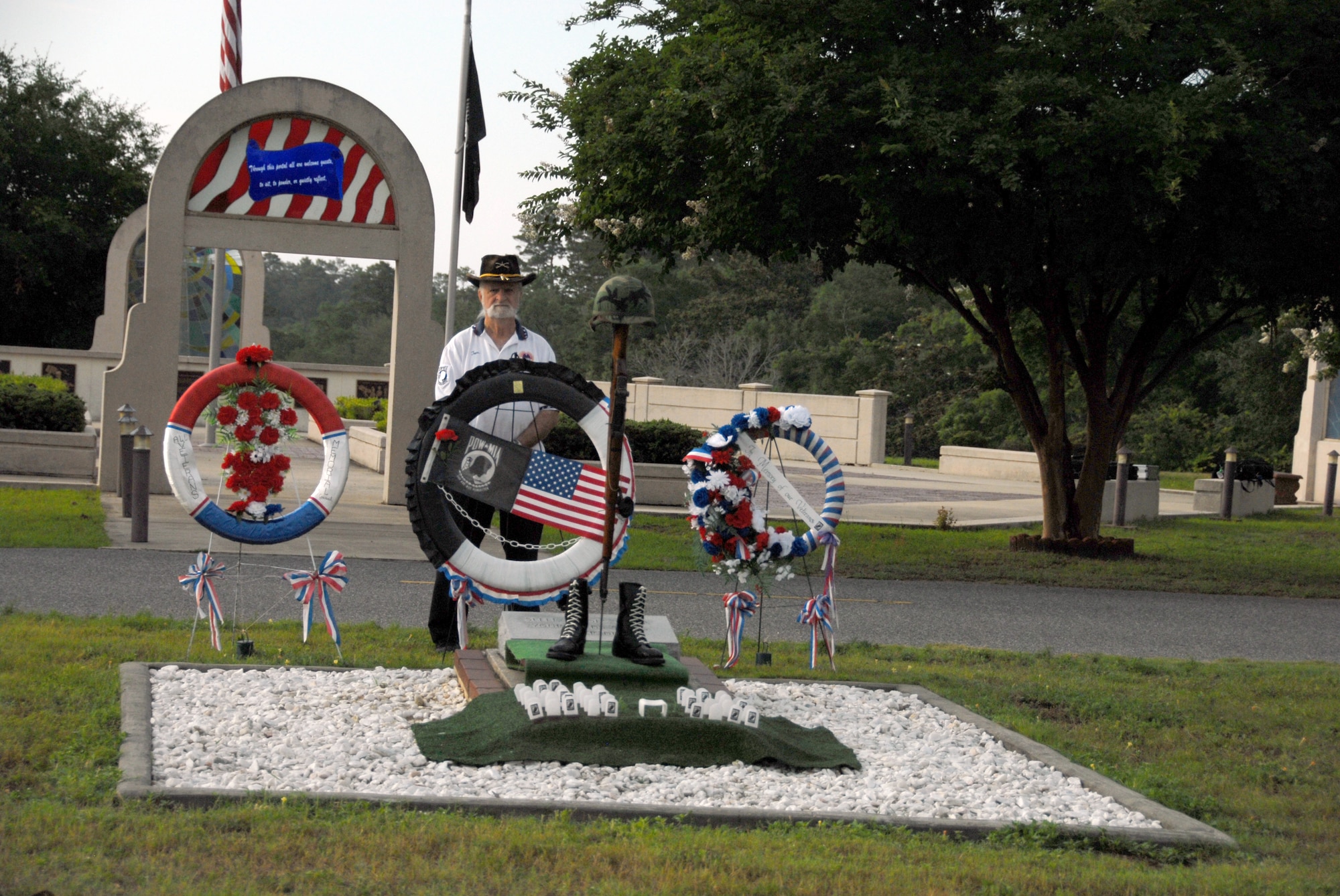 A volunteer stands in silent vigil at the All Veterans Memorial during the 25th Anniversary of the Gate-to-Gate run/walk event held annually on Memorial Day at Eglin Air Force Base, Fla. (U.S. Air Force photo/Staff Sgt. Stacia Zachary)