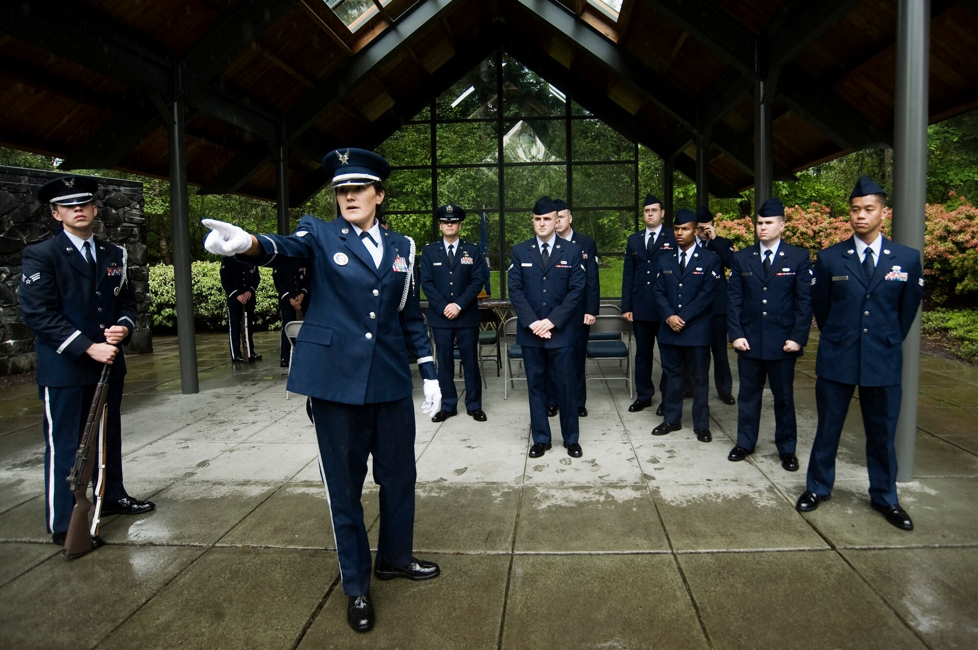 Tech. Sgt. Bonnie Longie, 62nd FSS, assigns positions for members of the Base Honor Guard from McChord Field and volunteers participating in a funeral service for Tuskegee Airman 1st Lt. Eldridge Freeman at Tahoma National Cemetery May 28. (U.S. Air Force Photo/Abner Guzman)