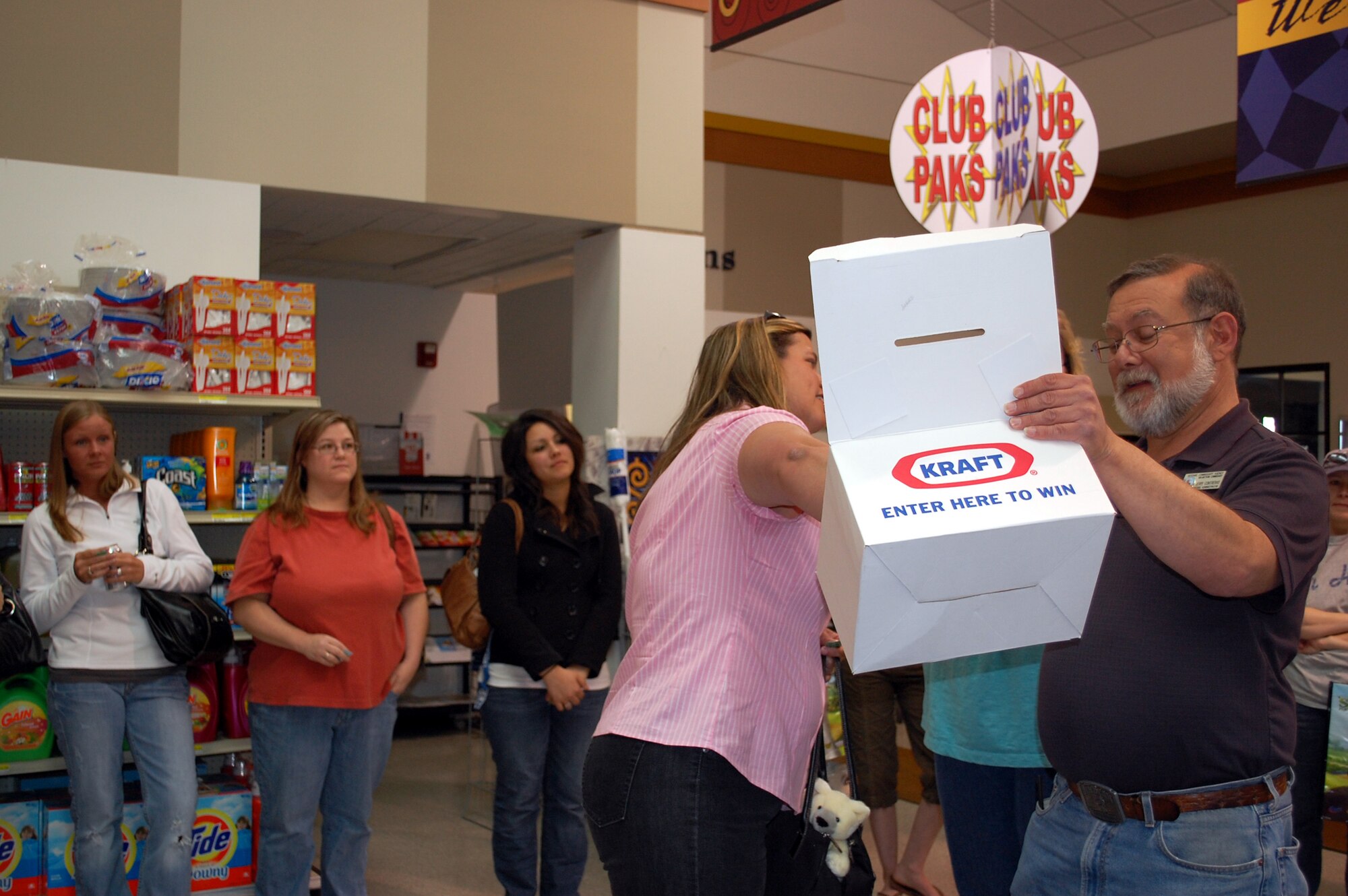Teresa Connor draws the next winning ticket for door prizes. Twenty-seven spouuses of deployed Team Malmstrom members came out for a night of fun in their honor at the Commissary May 23. (U.S. Air Force photo/Valerie Mullett)