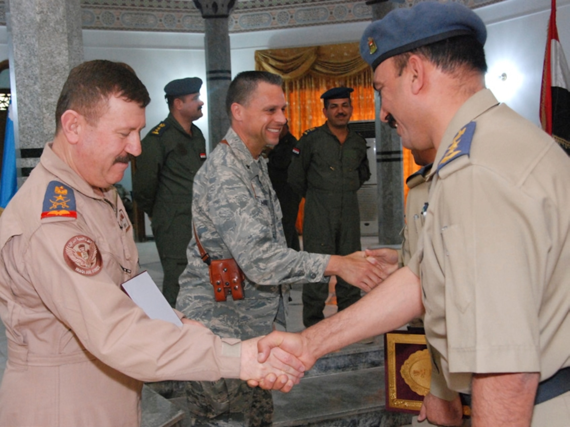 Iraqi air force sLt. Gen. Anwar, commander and U.S. Air Force Brig. Gen. Scott Hanson, commander, 321 Air Expeditionary Wing congratulate students for their accomplishment in completing the basic officers safety course at Hawk Base May 23, 2010. (Iraqi air force photo by Warrant Officer Rassul, HQ Public Affairs/released.)