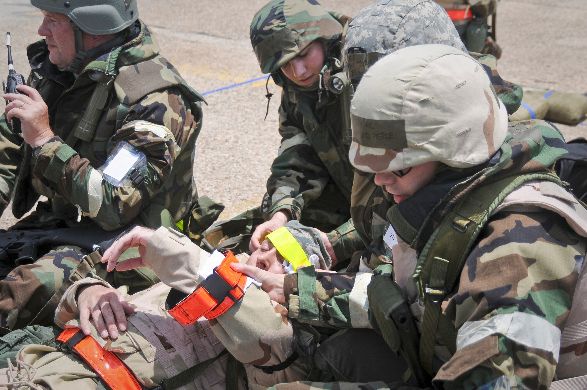 Members of the 123rd Airlift Wing render first-aid to an Airman from the 317th Airlift Group after a simulated attack on their shared facilities during an operational readiness inspection May 20, 2010, at the Gulfport Combat Readiness Training Center in Gulfport, Miss. (U.S. Air Force photo/Tech. Sgt. Dennis Flora)