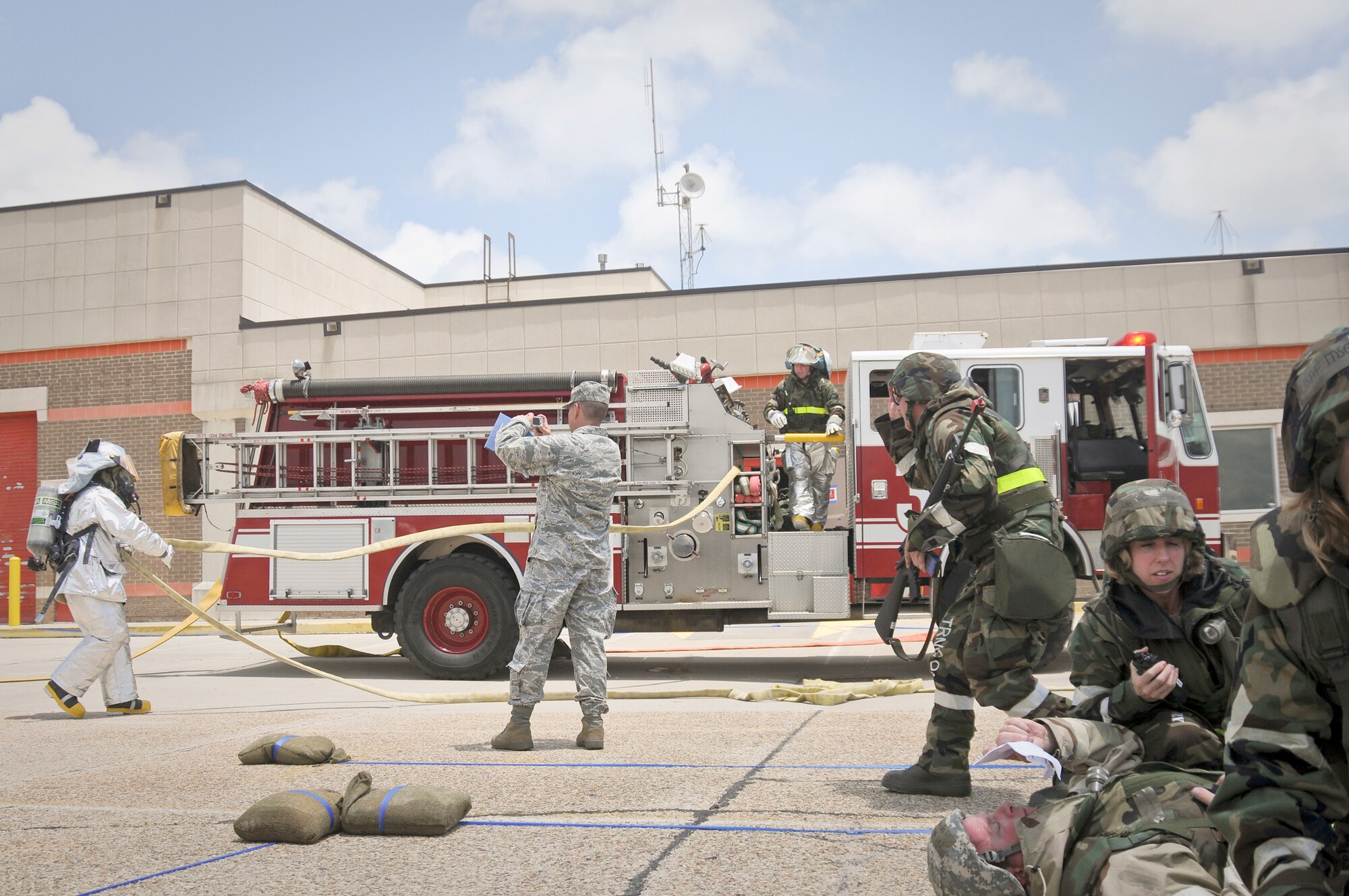 Members of the 123rd Airlift Wing fire department respond to a simulated fire during an operational readiness inspection May 20, 2010, at the Gulfport Combat Readiness Training Center in Gulfport, Miss. (U.S. Air Force photo/Tech. Sgt. Dennis Flora)