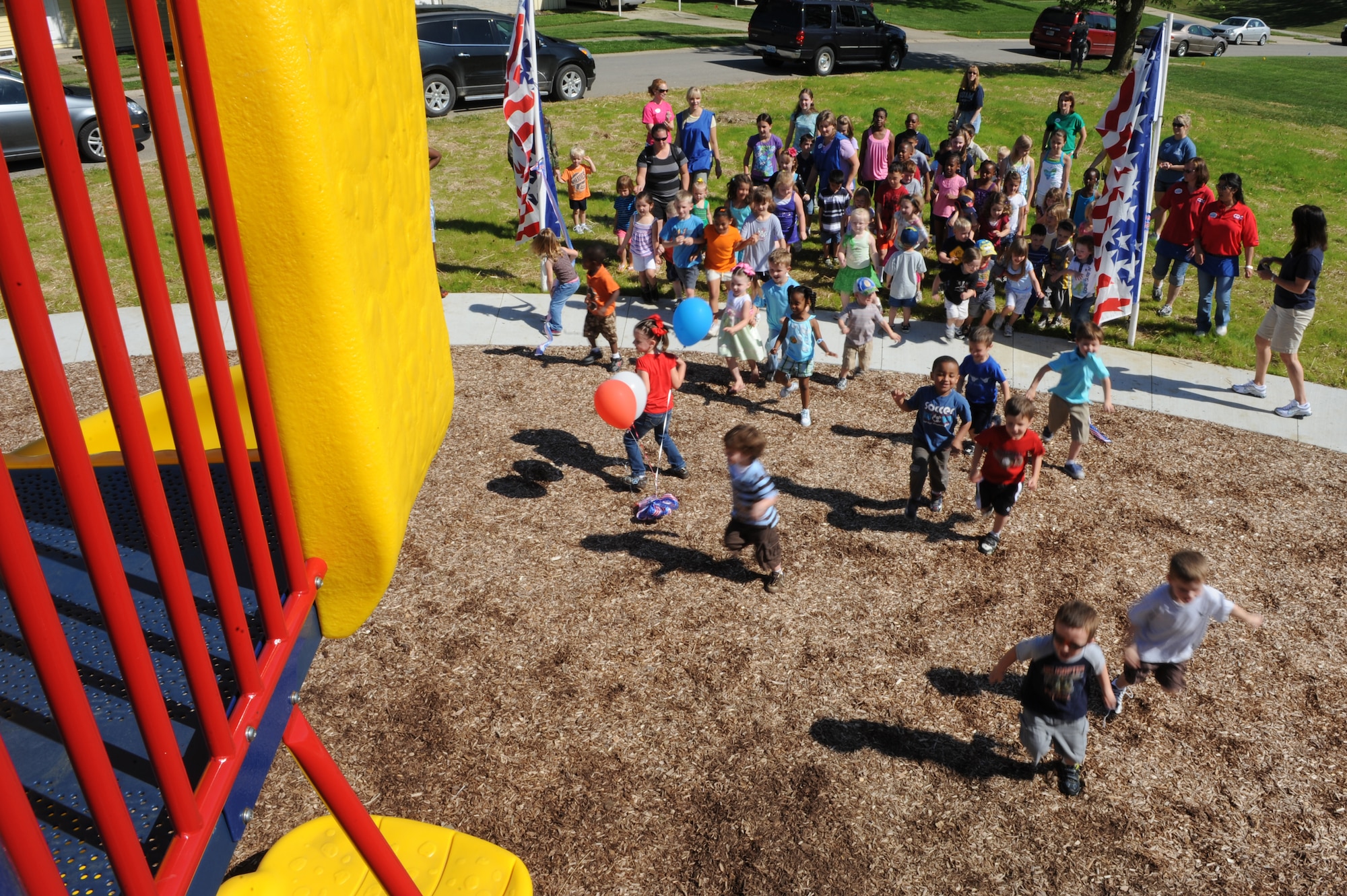 WHITEMAN AIR FORCE BASE, Mo. - Team Whiteman children storm the new playground located near Spirit Gate as part of the opening ceremony May 27. The new playground was constructed in conjunction with the new base housing project. (U.S. Air Force photo/ Airman 1st Class Carlin Leslie) 