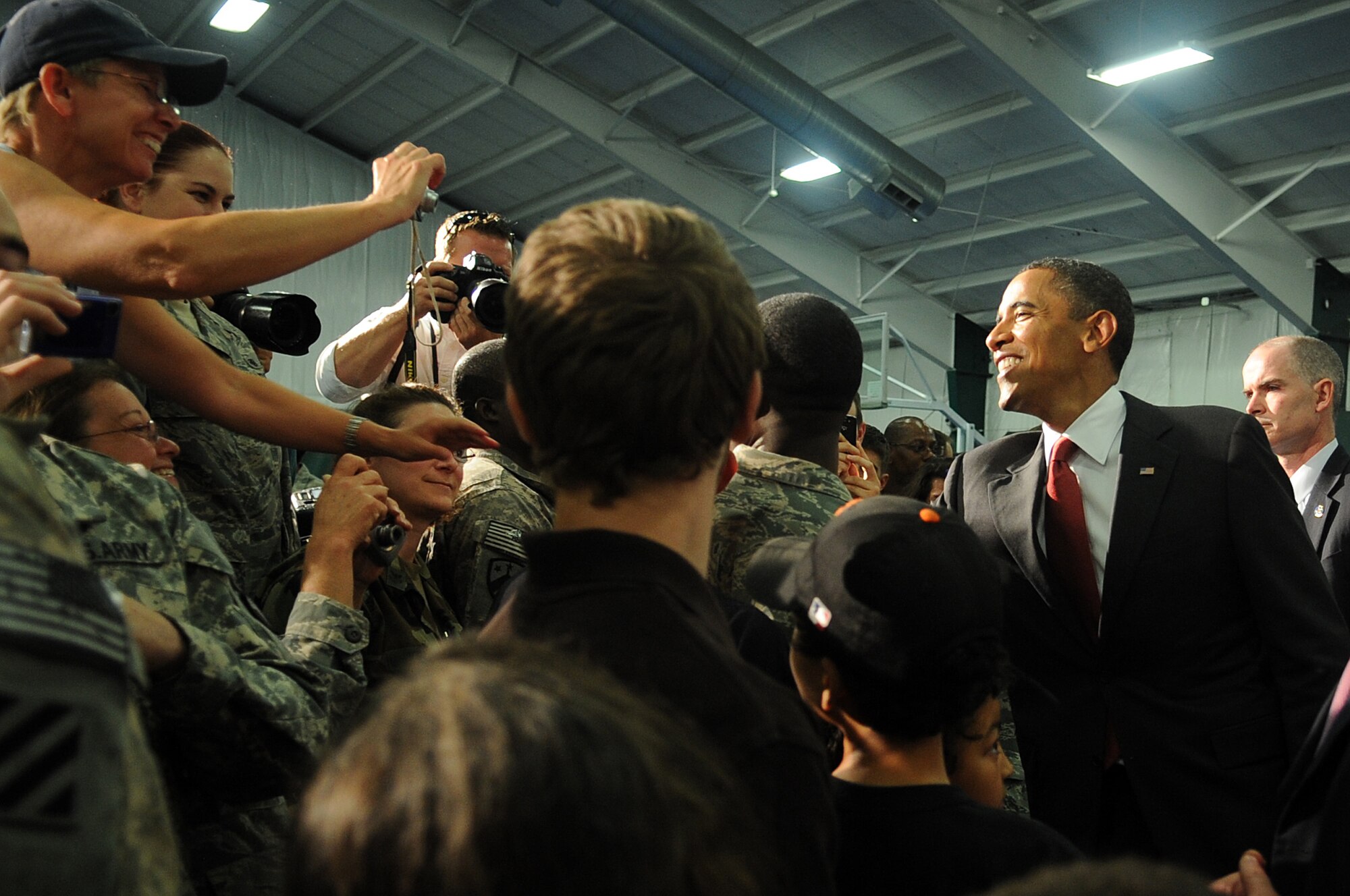 JOINT BASE ANDREWS, Md. -- President Barack Obama shakes hands with troops
and family members after his Memorial Day speech inside the Tactical Fitness
Center here May 31, 2010. The President's speech was originally scheduled to take place at the Abraham Lincoln National Cemetery in Elwood, Ill., but was moved to Andrews due to severe weather. (U.S. Air Force photo by Senior Airman Melissa V. Brownstein)
