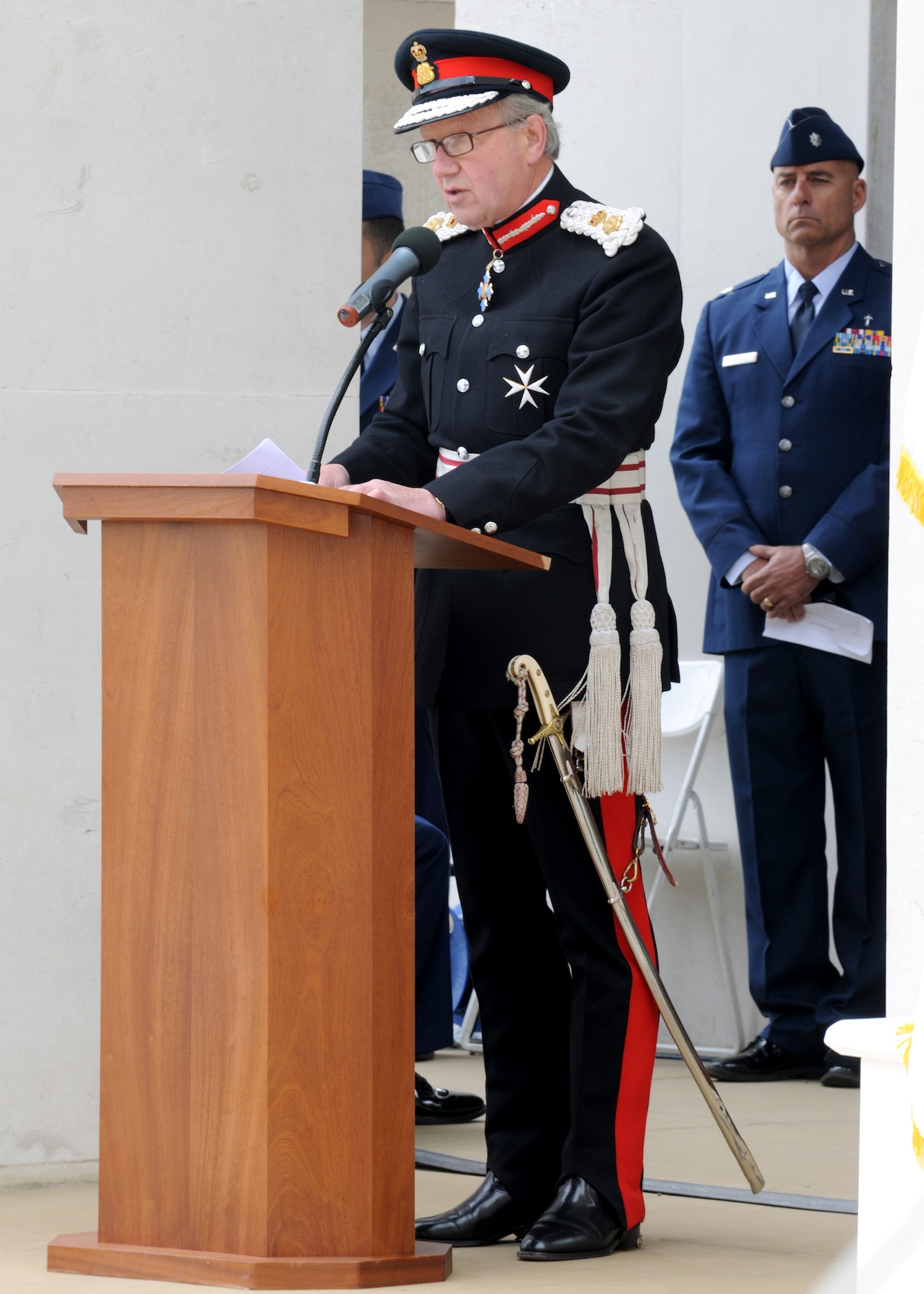 RAF MILDENHALL, England – Hugh Duberly, Her Majesty's Lord-Lieutenant of Cambridgeshire, speaks to a somber audience during the Memorial Day ceremony at Madingley Memorial Cemetery May 31. The event included a wreath laying and a 21-gun salute. (U.S. Air Force photo/ Staff Sgt. Jerry Fleshman)