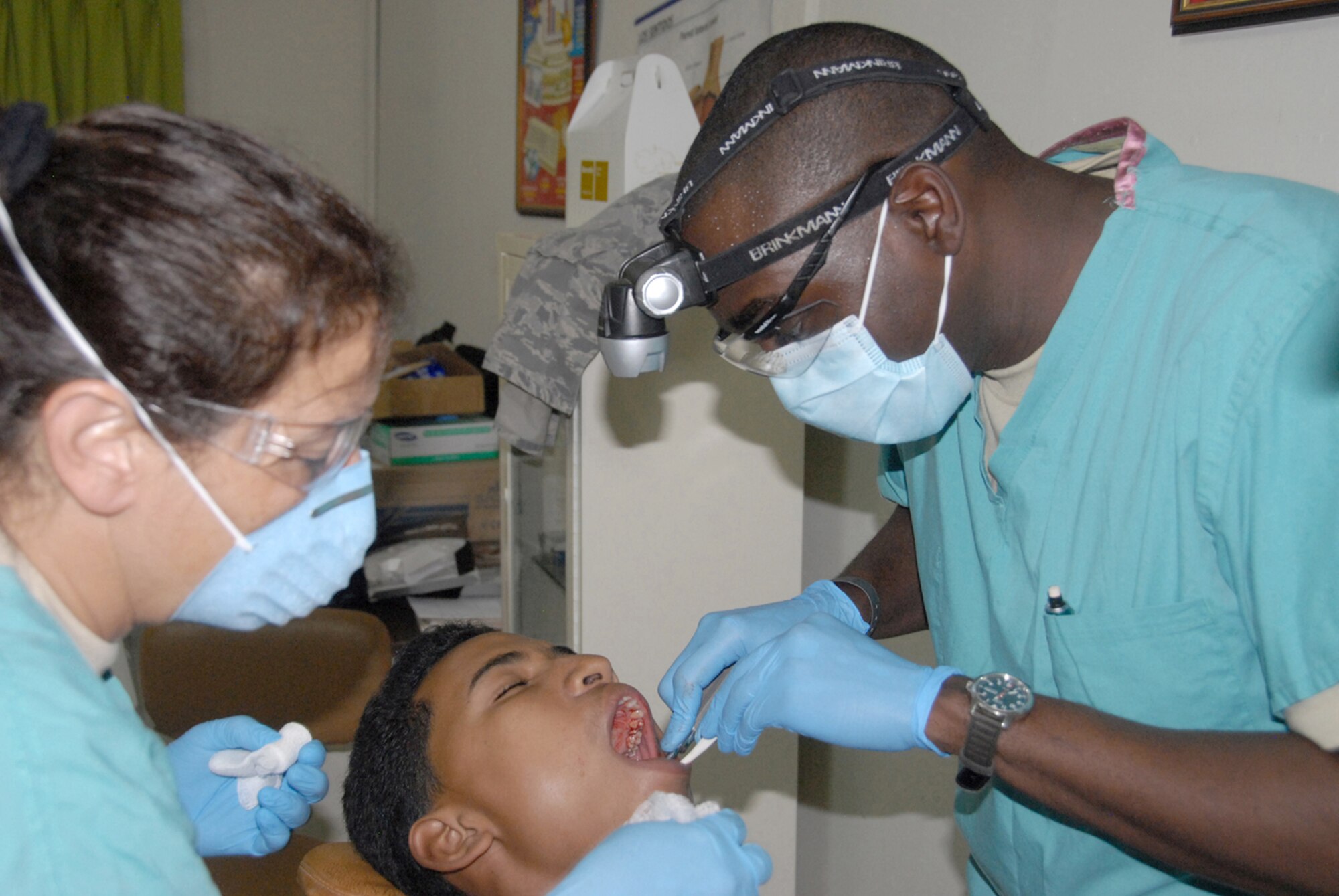 Capt. (Dr.) Jonathan Johnson extracts a tooth during a medical readiness exercise May 24, 2010, in the Dominican Republic. A team of 39 medical specialists from Air Force Reserve Command is providing medical care to four towns in the Puerto Plata region of the country. Doctor Johnson is a dentist from the 622nd Aeromedical Staging Squadron at Robins Air Force Base, Ga.(U.S. Air Force photo/Master Sgt. Chance C. Babin)
