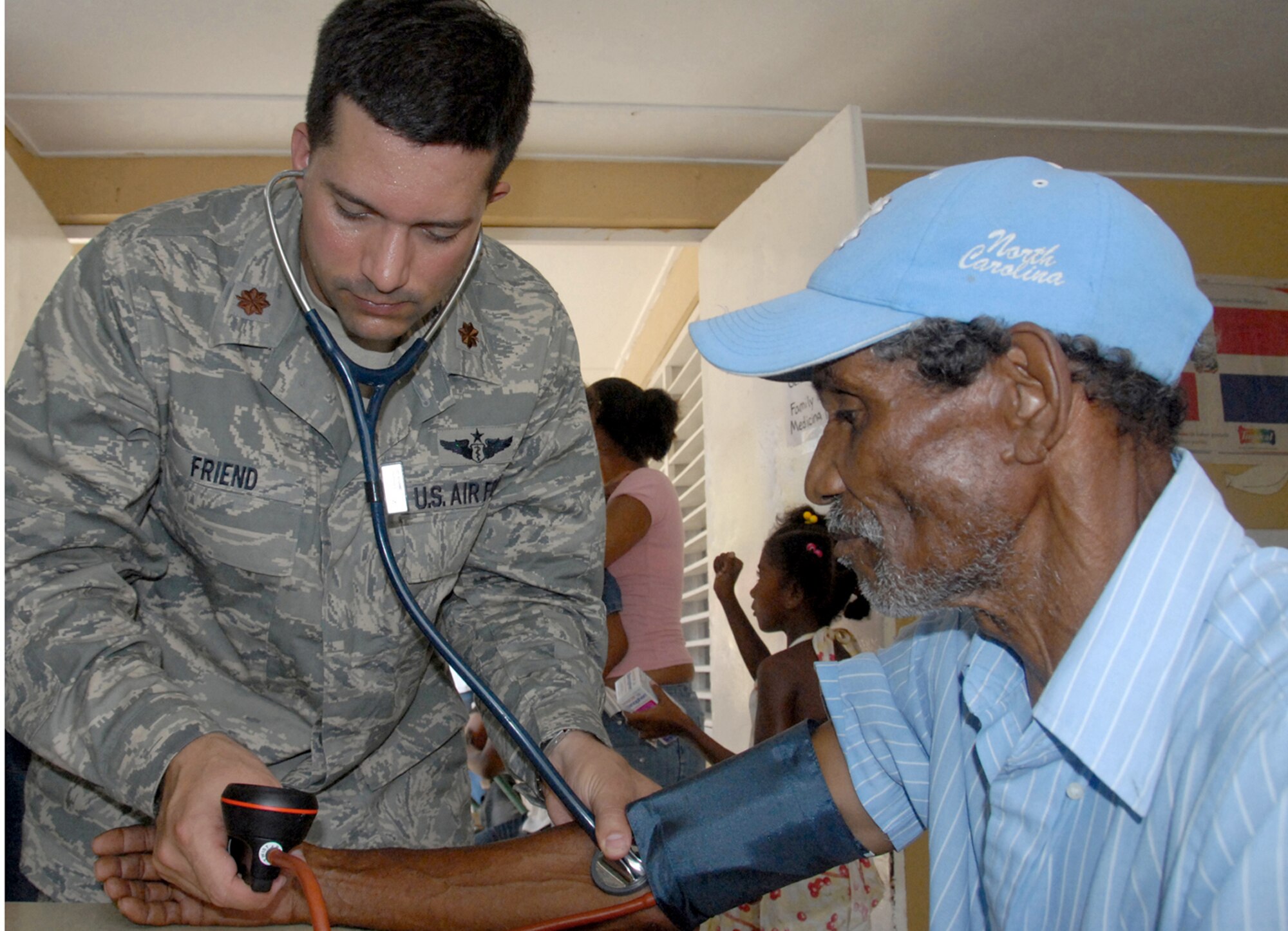 Maj. (Dr.) Rodney Friend checks a Dominican patient's blood pressure during a medical readiness exercise May 24, 2010, in the Dominican Republic. A team of 39 medical specialists from Air Force Reserve Command is providing medical care to four towns in the Puerto Plata region of the country. Doctor Friend is a physician with the 927th Aeromedical Staging Squadron at MacDill Air Force Base, Fla. (U.S. Air Force photo/Master Sgt. Chance C. Babin)