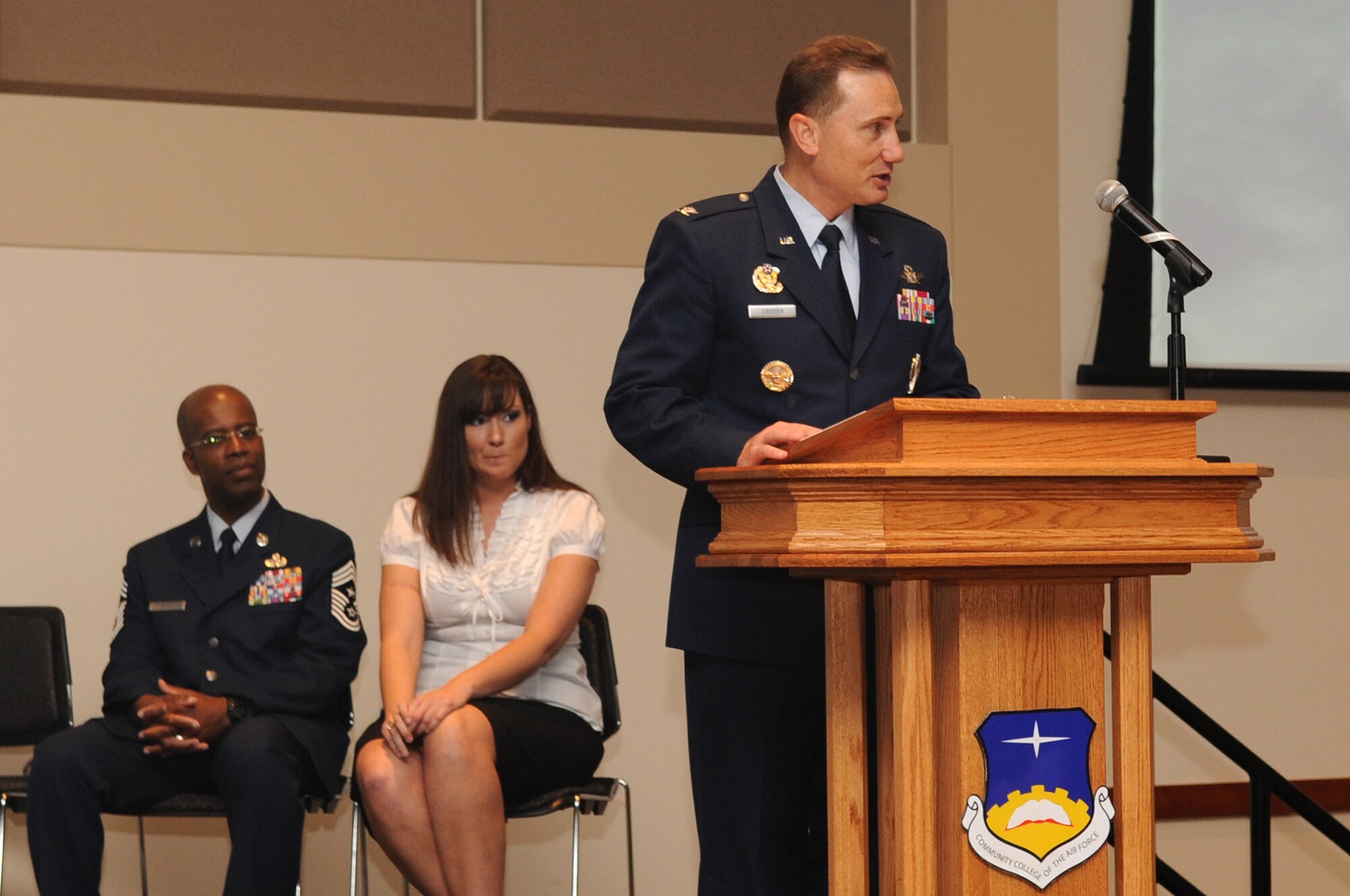 BUCKLEY AIR FORCE BASE, Colo. -- Col. Clint Crosier, 460th Space Wing commander, speaks to 27 graduates at the Community College of the Air Force graduation May 27.(U.S. Air Force photo by Airman 1st Class Manisha Vasquez)