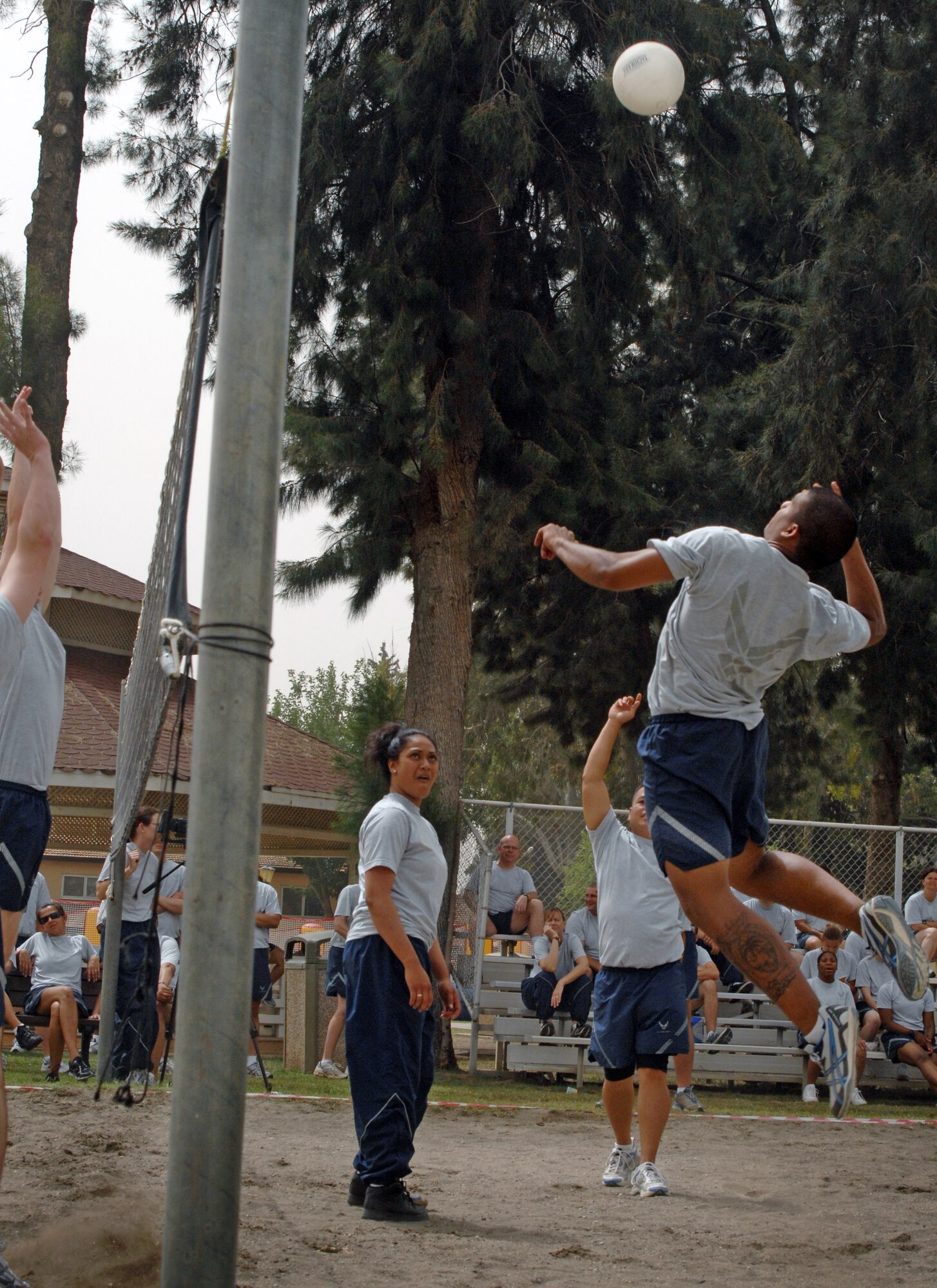 A member of the 39th Security Forces Squadron attempts to spike the ball during a game of volleyball as part of Wingman Day Friday, May 28, 2010 at Incirlik Air Base, Turkey. Wingman Day is an annual event bringing Airmen together through sports and recreation to focus on what it truly means to be a wingman. As part of Incirlik’s Wingman Day, Airmen from every squadron participated against each other in friendly games of volleyball, human foosball, a human wrecking ball and tricycle racing. (U.S. Air Force photo/Senior Airman Sara Csurilla)