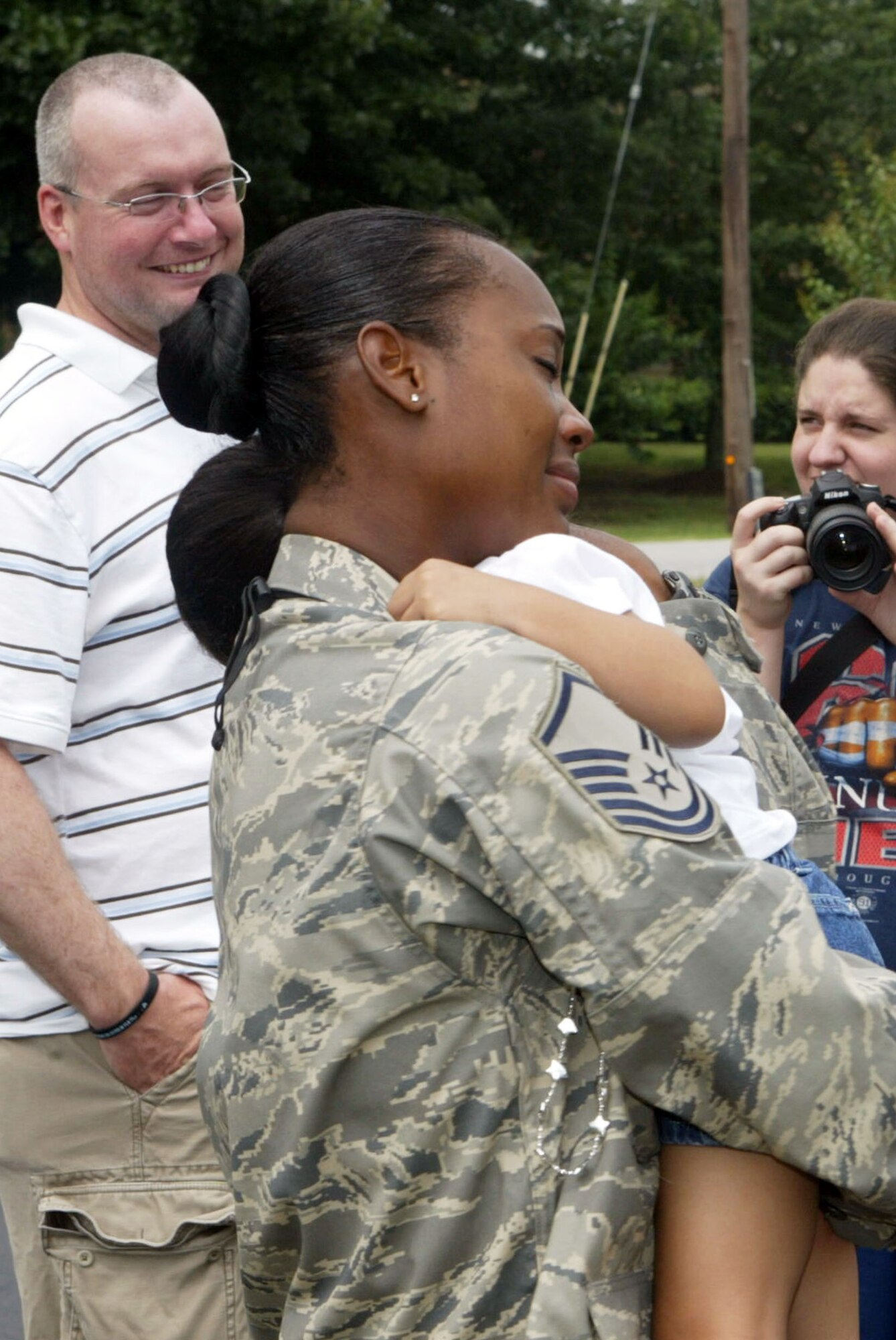 Master Sgt. Engle R. Coulter, 94th Security Forces Squadron, receives an emotional welcome home hug from her daughter Memorial Day, May 31, upon her return home from a four month deployment to Iraq. (U.S. Air Force photo/Don Peek)