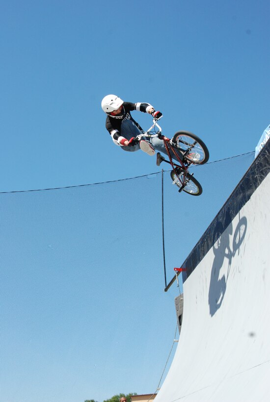 JOINT BASE ANDREWS, Md. -- A team BMX rider for ASA Entertainment, prepares to hit the ramp at the Joint Service Open House here May 15. The BMX rider joins other extreme athletes in supporting the Air Force Reserve recruiting campaign, "Grab Some Air," which aims at attracting an active demographic of 17-34 year-olds to the Reserve. The JSOH allows members of the public an excellent opportunity to meet and interact with the men and women of the Armed Forces and to show them America’s skilled military. (U.S. Air Force photo/Capt. Rebecca Garcia) 