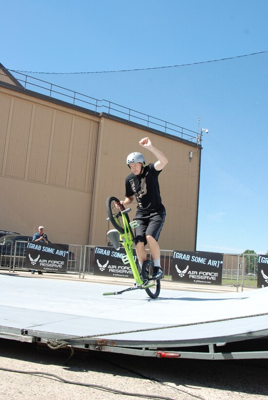 JOINT BASE ANDREWS, Md. -- Trevor Meyer, a team BMX rider for ASA Entertainment, balances his bike while standing on his pegs at the Joint Service Open House here May 15. Mr. Meyer joins other extreme athletes in supporting the Air Force Reserve recruiting campaign, "Grab Some Air," which aims at attracting an active demographic of 17 to 34-year-olds to the Reserve. The JSOH allows members of the public an excellent opportunity to meet and interact with the men and women of the Armed Forces and to show them America’s skilled military. (U.S. Air Force photo/Capt. Rebecca Garcia) 
