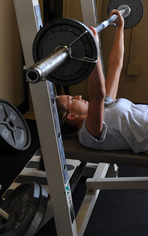 Senior Airman Megan Haskins, 30th Intelligence Squadron, completes a repetition on May 26, 2010 at Langley Air Force Base, Va. A bench press contest, along with other events, was part of the 480th Intelligence, Surveillance and Reconnaissance Wing Warrior Games. (U.S. Air Force photo by Senior Airman Zachary Wolf)
