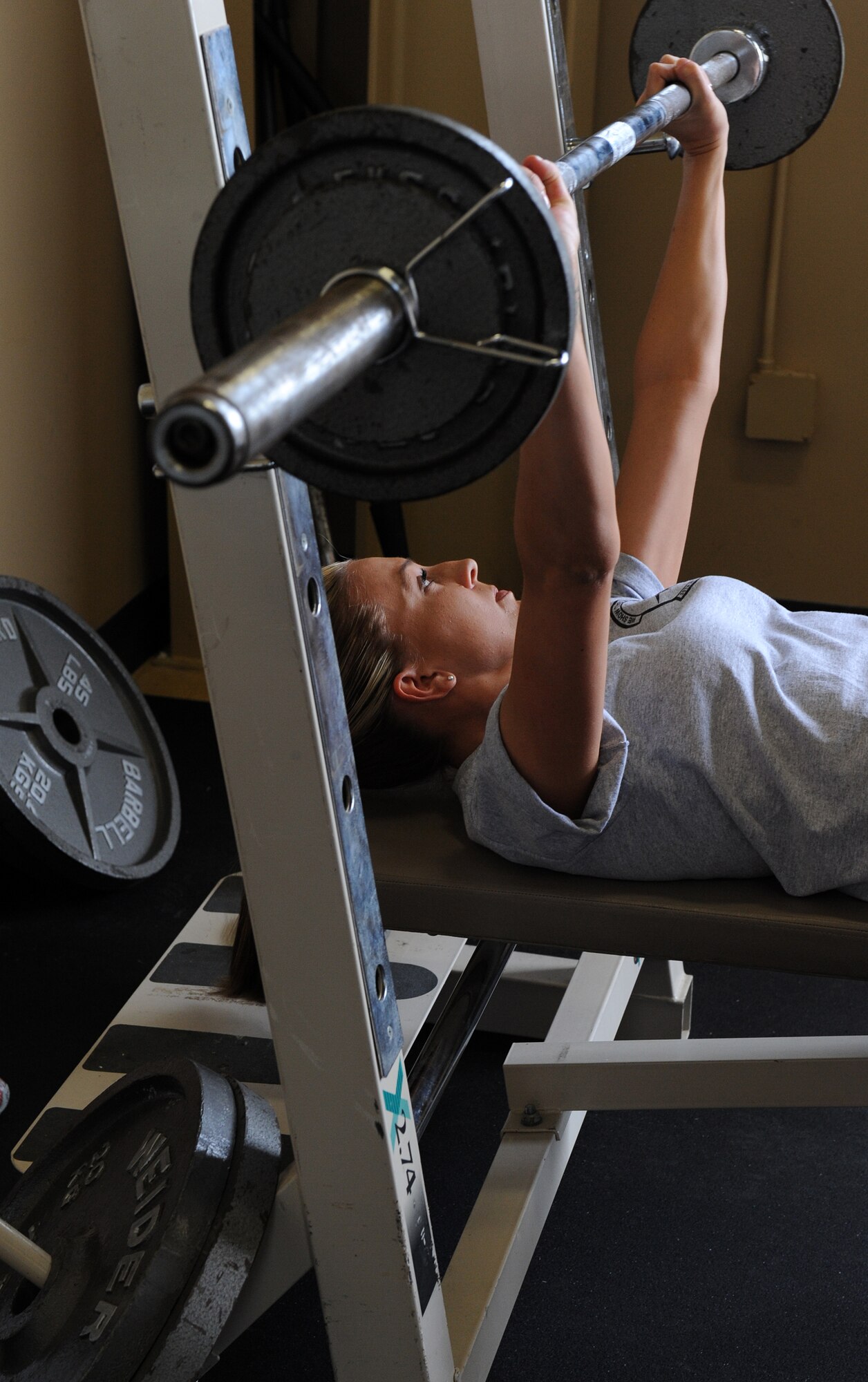 Senior Airman Megan Haskins, 30th Intelligence Squadron, completes a repetition on May 26, 2010 at Langley Air Force Base, Va. A bench press contest, along with other events, was part of the 480th Intelligence, Surveillance and Reconnaissance Wing Warrior Games. (U.S. Air Force photo by Senior Airman Zachary Wolf)
