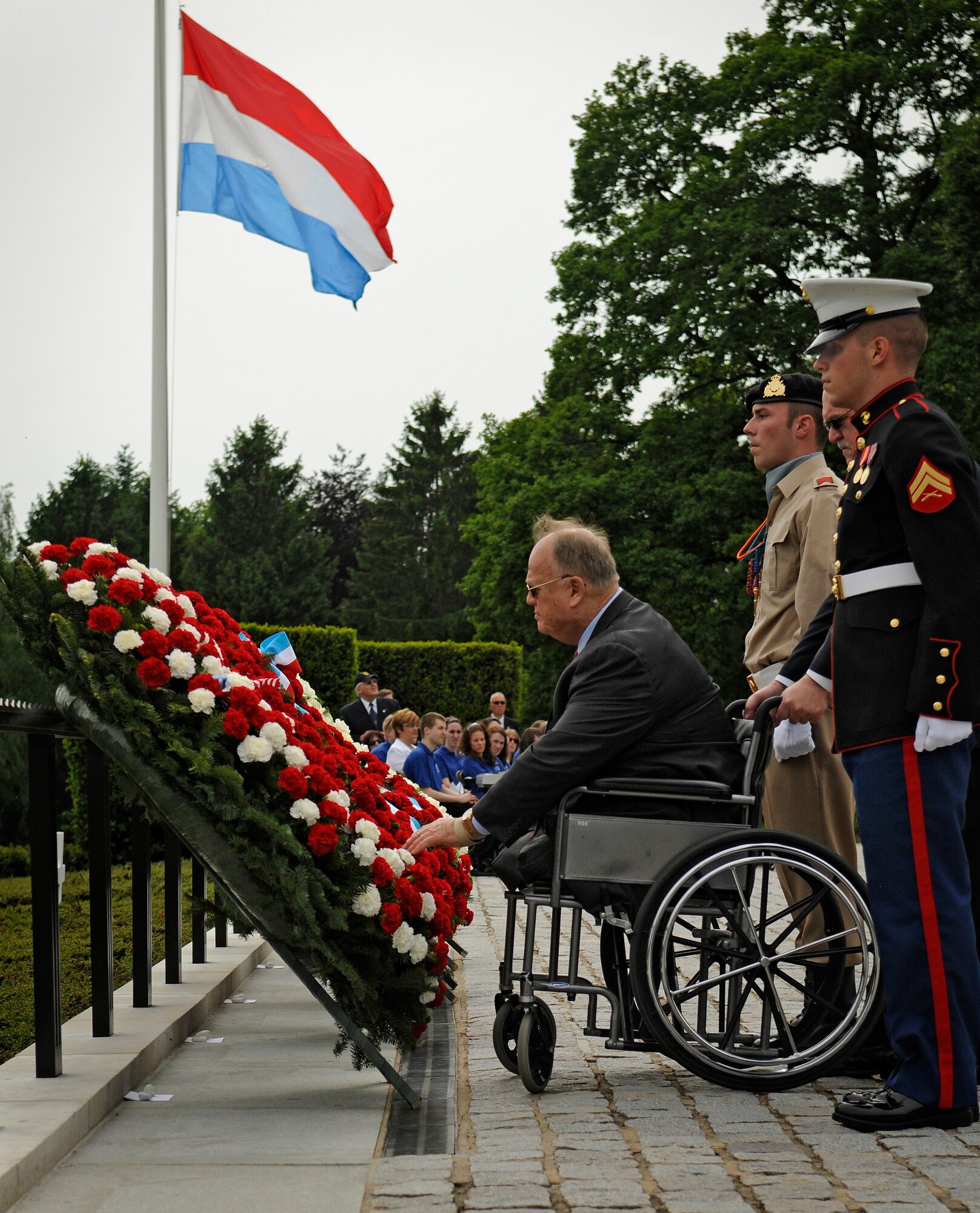 LUXEMBOURG CITY, Luxembourg – Secretary Max Cleland, American Battle Monuments Commission, lays a wreath at the Luxembourg American Cemetery and Memorial during a Memorial Day Ceremony May 29. The ceremony commemorated the 65th anniversary of the end of World War II. (U.S. Air Force photo/Senior Airman Benjamin Wilson)