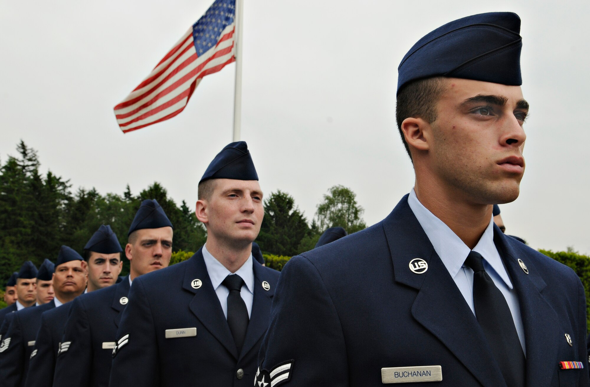 LUXEMBOURG CITY, Luxembourg – A military formation of 52nd Fighter Wing members stand in front of an American Flag at the Luxembourg American Cemetery and Memorial during a Memorial Day ceremony May 29. Memorial Day was officially proclaimed in 1868 and became widespread by 1902. It was named a federal holiday in 1971. (U.S. Air Force photo/Senior Airman Benjamin Wilson)