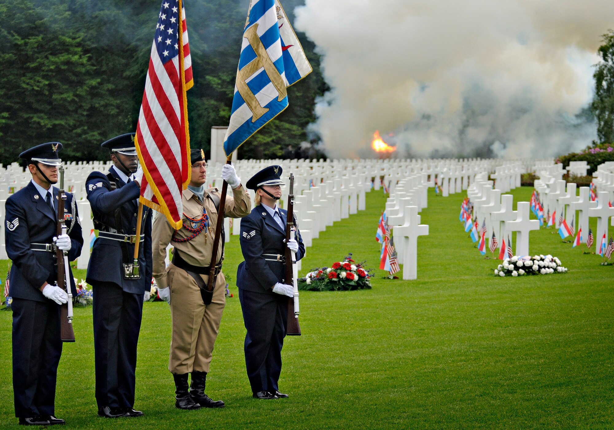 LUXEMBOURG CITY, Luxembourg – A flag detail stands at attention in the Luxembourg American Cemetery and Memorial for a 21-gun salute during a Memorial Day Ceremony May 29. The remains of 5,076 American servicemembers from all 50 states and the District of Columbia are interred in the cemetery. (U.S. Air Force photo/Senior Airman Benjamin Wilson)