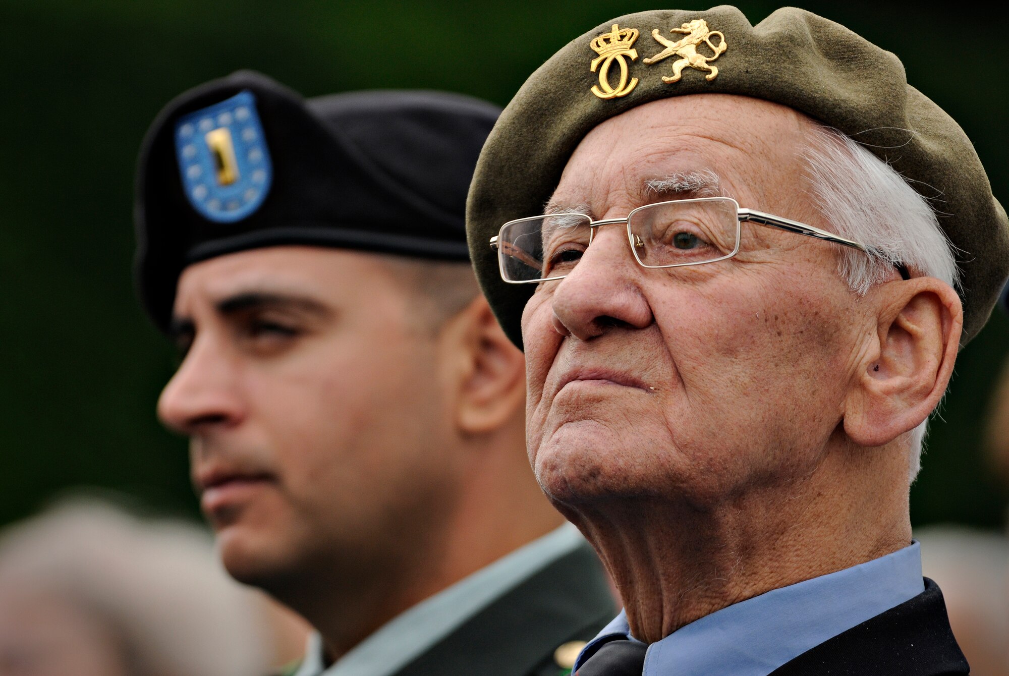 LUXEMBOURG CITY, Luxembourg – A veteran sits next to an Army lieutenant during a Memorial Day ceremony at the Luxembourg American Cemetery and Memorial May 29. The ceremony commemorated the 65th anniversary of the end of World War II. (U.S. Air Force photo/Senior Airman Benjamin Wilson)