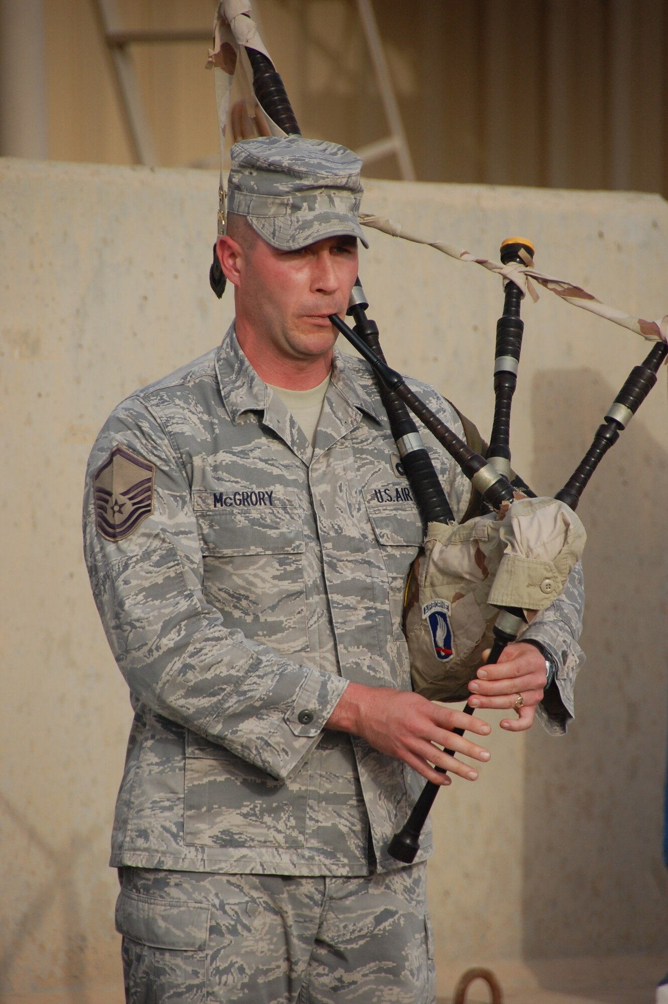 SOUTHWEST ASIA - U.S. Air Force Master Sgt. Paul McGrory, 386th Expeditionary Security Forces Squadron, plays "Amazing Grace" here May 31, 2010 during a special Memorial Day ceremony to honor servicemembers who have made the ultimate sacrifice in the defense of the United States. (U.S. Air Force photo by Staff Sgt. Lakisha A. Croley/Released)