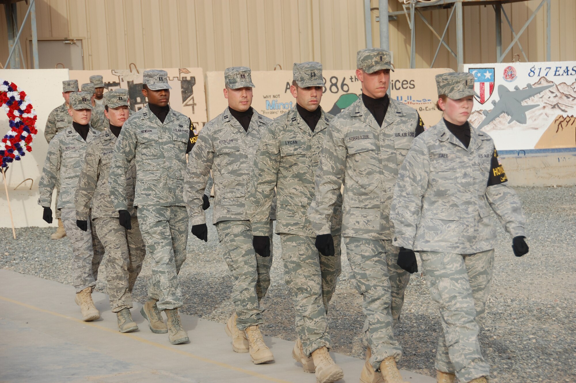 SOUTHWEST ASIA - U.S. Air Force company grade officers from the 386th Air Expeditionary Wing formed an honor guard detail for a special Memorial Day and retreat ceremony here May 31, 2010 at an air base. The team marched into position at the start of the ceremony to "retire the colors." (U.S. Air Force photo by Staff Sgt. Lakisha A. Croley/Released)