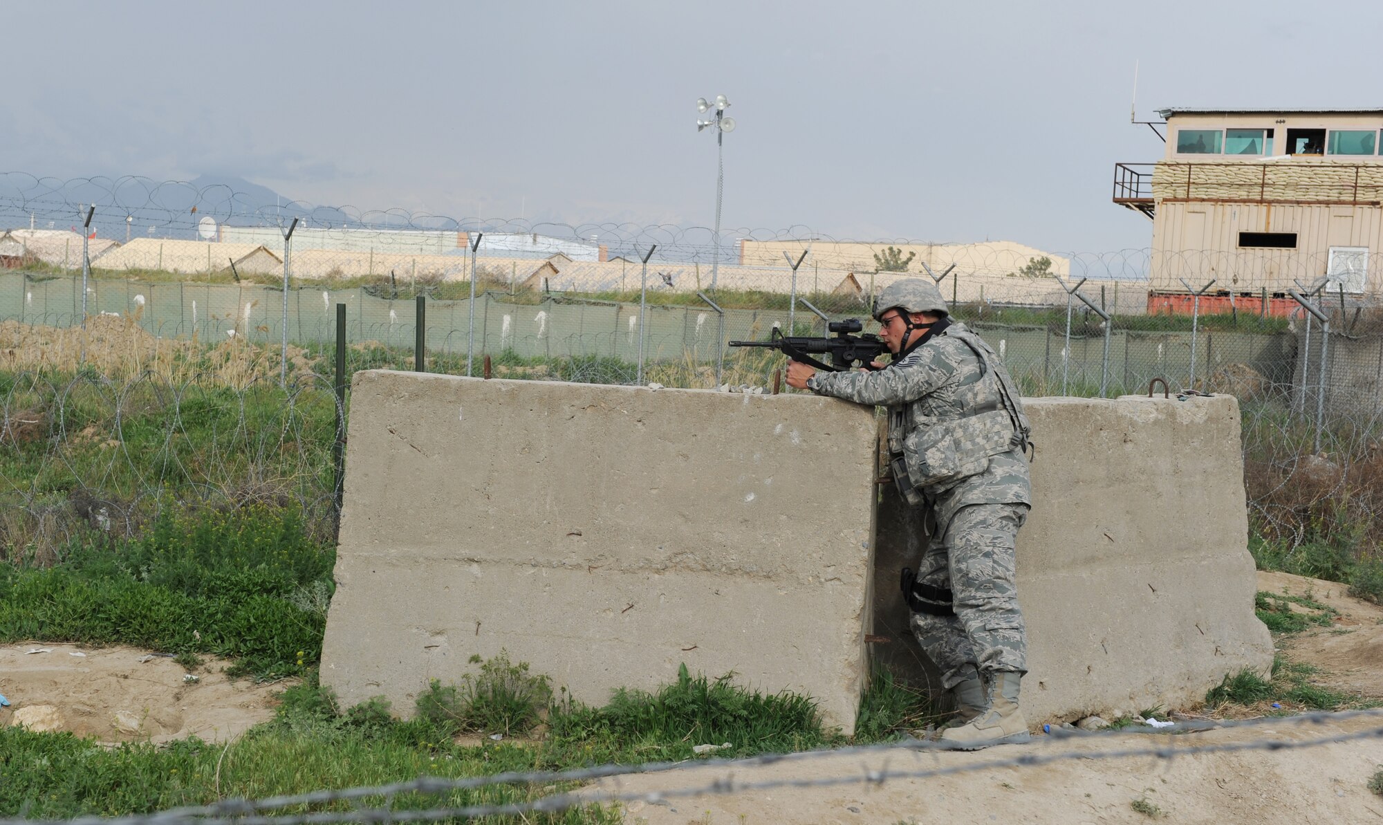 A 455th Expeditionary Security Forces Squadron Airman  provides over watch  during a humanitarian mission at Bagram Airfield, Afghanistan. Airmen of the 455th ESFS were primary defenders during an attack on the airfield May 19, 2010. (U.S. Air Force photo by Staff Sgt. Richard Williams)
