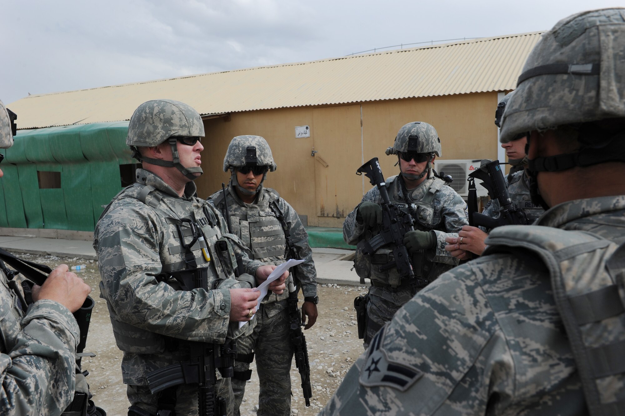 U.S. Air Force Capt. Jason Williams, 455th Expeditionary Security Forces Squadron, sector officer-in-charge, gives a mission brief to 455th ESFS Airmen during a humanitarian mission at Bagram Airfield, Afghanistan. During an attack on the airfield May 19, 2010, Captain Williams directed his Airmen to supplement perimeter defenses. Captain Williams is deployed from Keesler Air Force Base, Miss., and is a native of Asheboro, N.C. (U.S. Air Force photo by/ Staff Sgt. Richard Williams)
