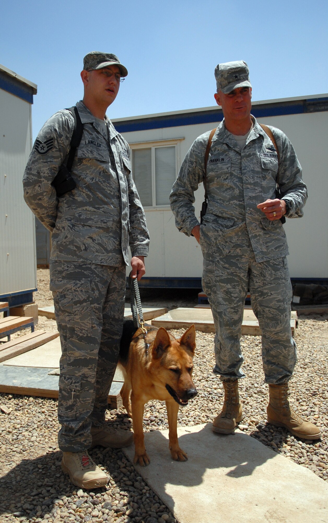 Staff Sgt. Justin Langley, a 732nd Expeditionary Security Forces Squadron K-9 handler out of forward-operating-base Kalsu, discusses performance, quality of life and standard of living feedback to Brig. Gen. Craig Franklin, the 332nd Air Expeditionary Wing commander. Sergeant Morgan is one of more than 1,100 Joint Expeditionary Tasked Airmen serving in 28 FOBs throughout Iraq. (U.S. Air Force photo/Senior Airman Wes Carter)
