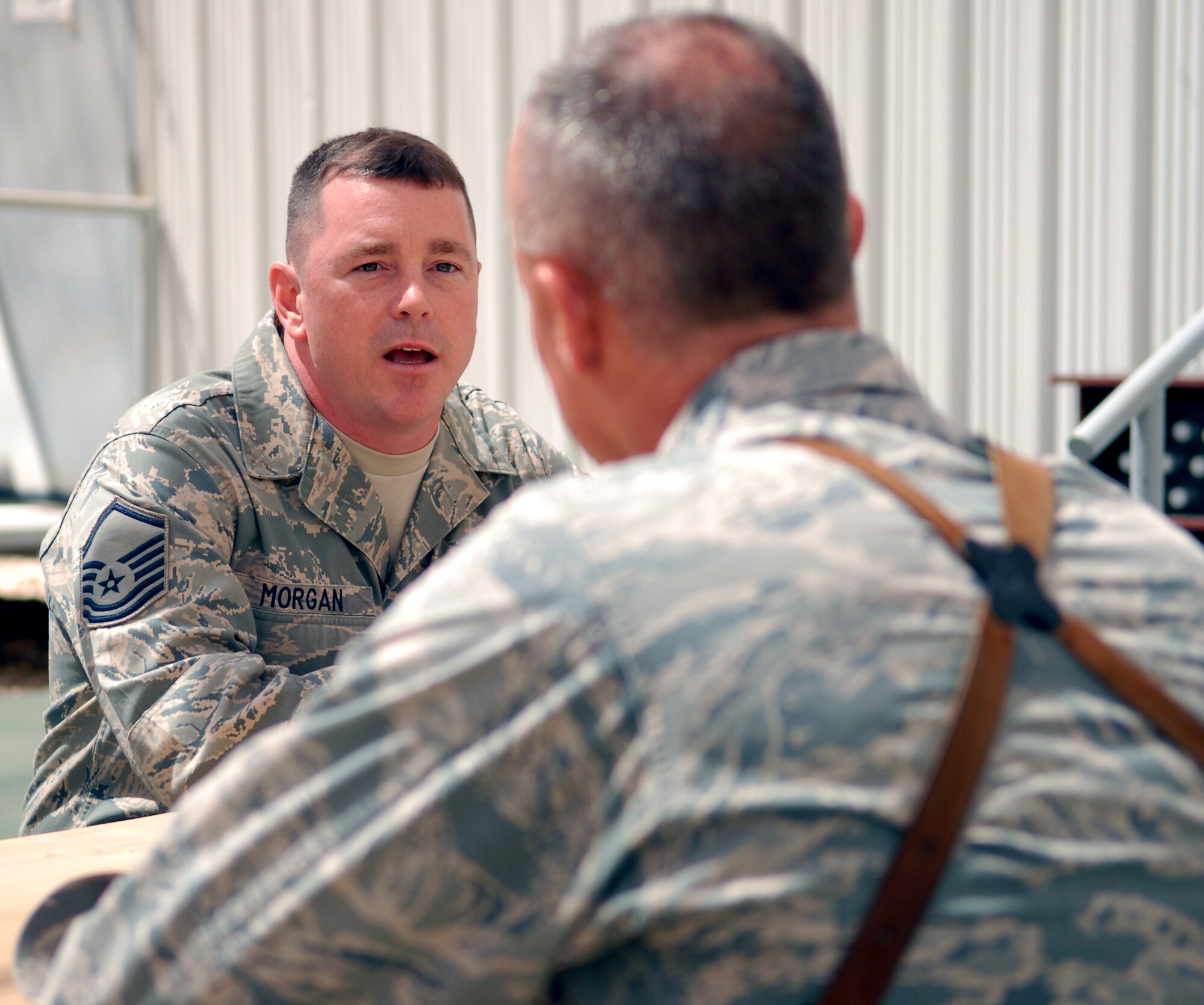 Master Sgt. Patrick Morgan, 732nd Expeditionary Logistics Readiness Squadron redistribution property assistance team at forward-operating-base Kalsu, Iraq NCO in charge, gives performance, quality of life and standard of living feedback to Brig. Gen. Craig Franklin, the 332nd Air Expeditionary Wing commander. Sergeant Morgan is one of more than 1,100 Joint Expeditionary Tasked Airmen serving in 28 FOBs throughout Iraq. (U.S. Air Force photo/Senior Airman Wes Carter/RELEASED)