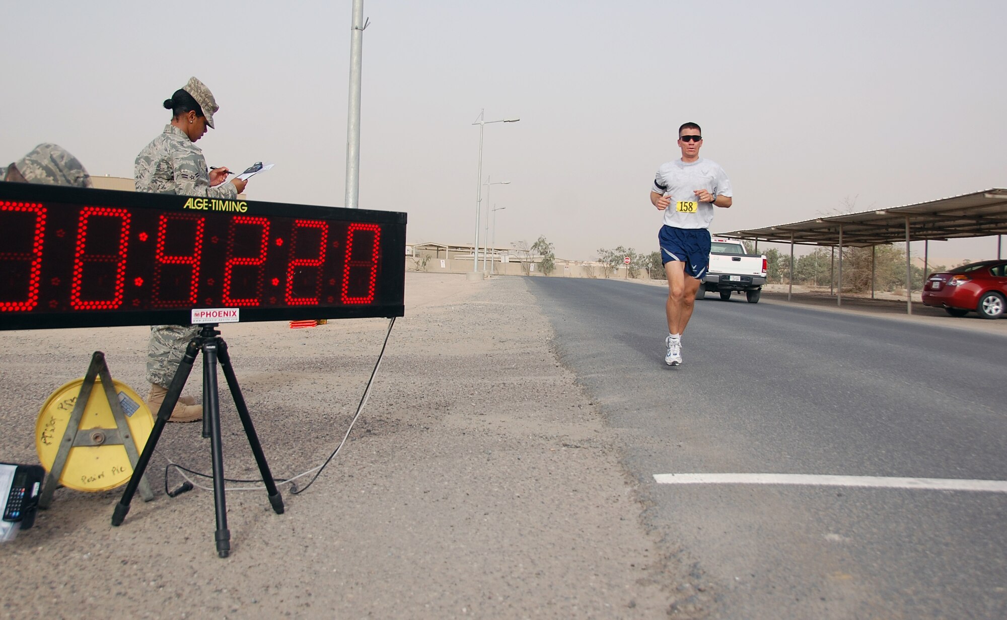 U.S. Air Force Capt. Gregory Cameron sprints to the finish line of a Memorial Day 10K fun run May 31, 2010 at an air base in Southwest Asia. Captain Cameron, who is deployed with the 386th Expeditionary Maintenance Group, took first place in the fun run at 42:22. (U.S. Air Force photo by Tech. Sgt. Lindsey Maurice/Released)