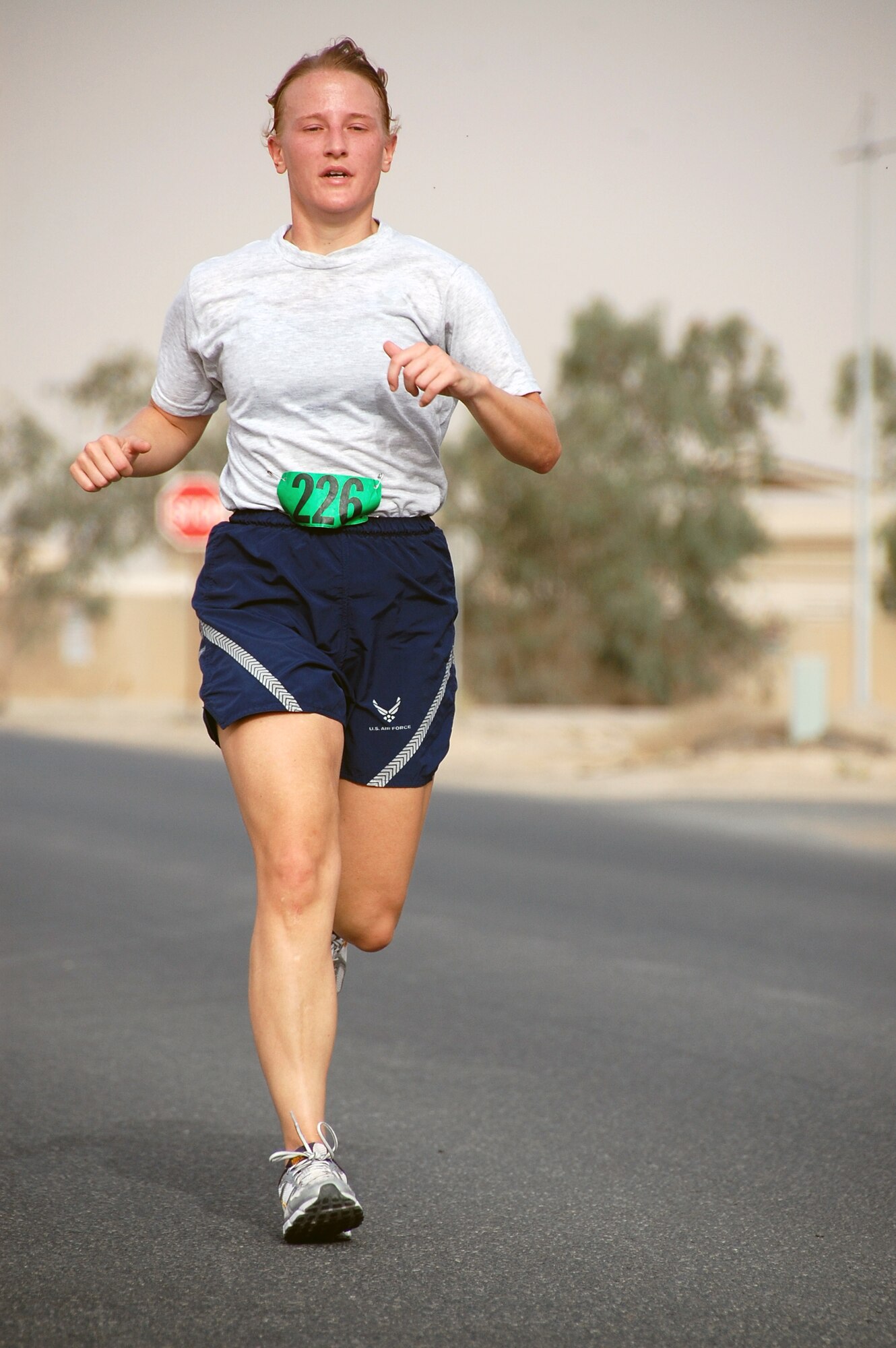 U.S. Air Force Capt. Andrea Matalik of the 386th Expeditionary Force Support Squadron sprints toward the finish line of a Memorial Day 10K fun run May 31, 2010 at an air base in Southwest Asia. The captain placed third in the 20-29 year-old category at 51:18. (U.S. Air Force photo by Tech. Sgt. Lindsey Maurice/Released)