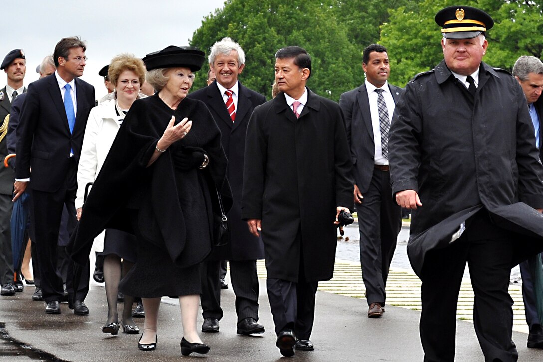 Her Majesty Queen Beatrix, left, Queen of the Netherlands, walks with U.S. Veterans Affairs Secretary Eric K. Shinseki to preside over the 66th annual American Memorial Day ceremony at the Netherlands American Cemetery and Memorial in Margraten, Netherlands, May 30, 2010.