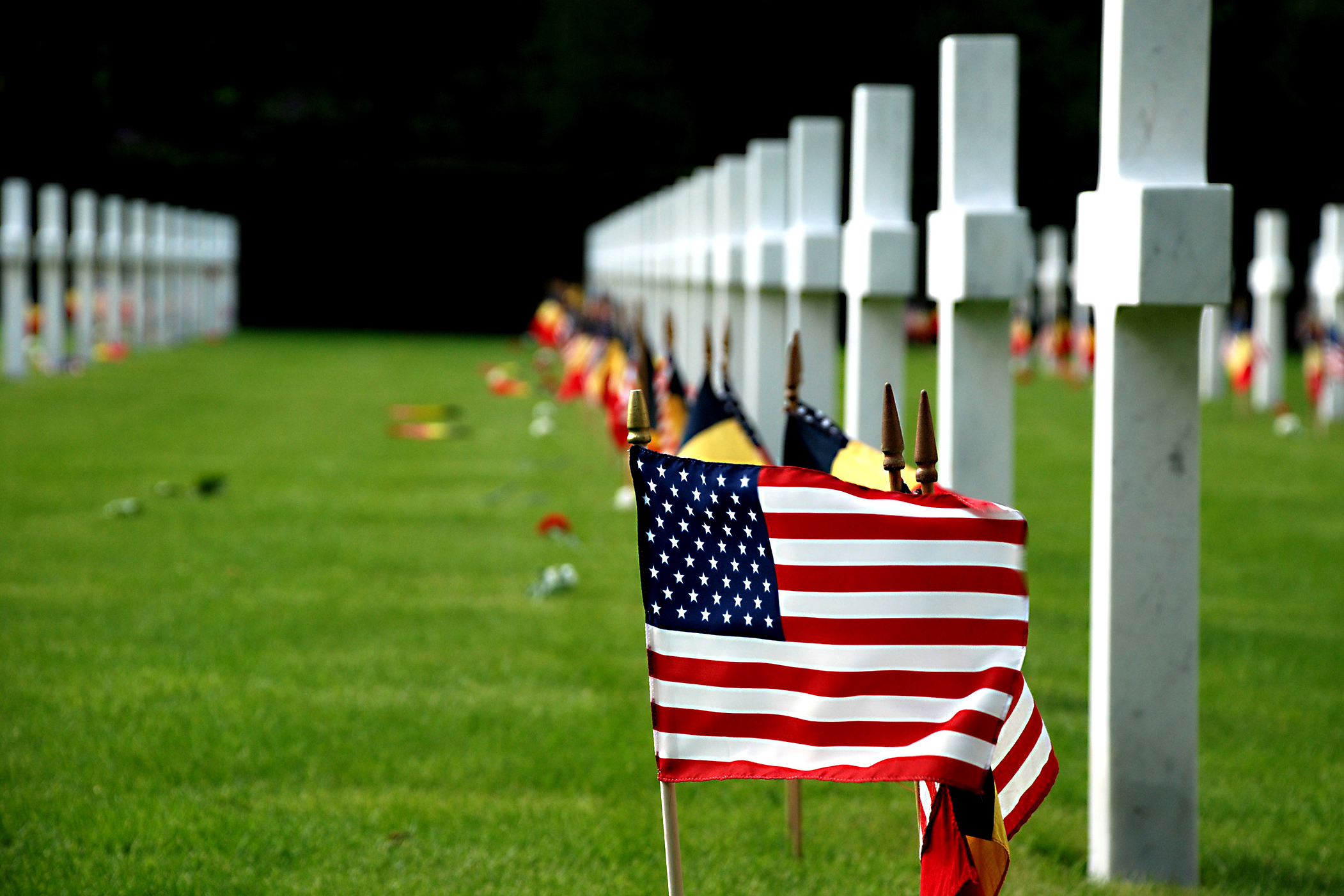 American And Belgian Flags Wave Beside The Tombstones Of The 368 American World War I Soldiers