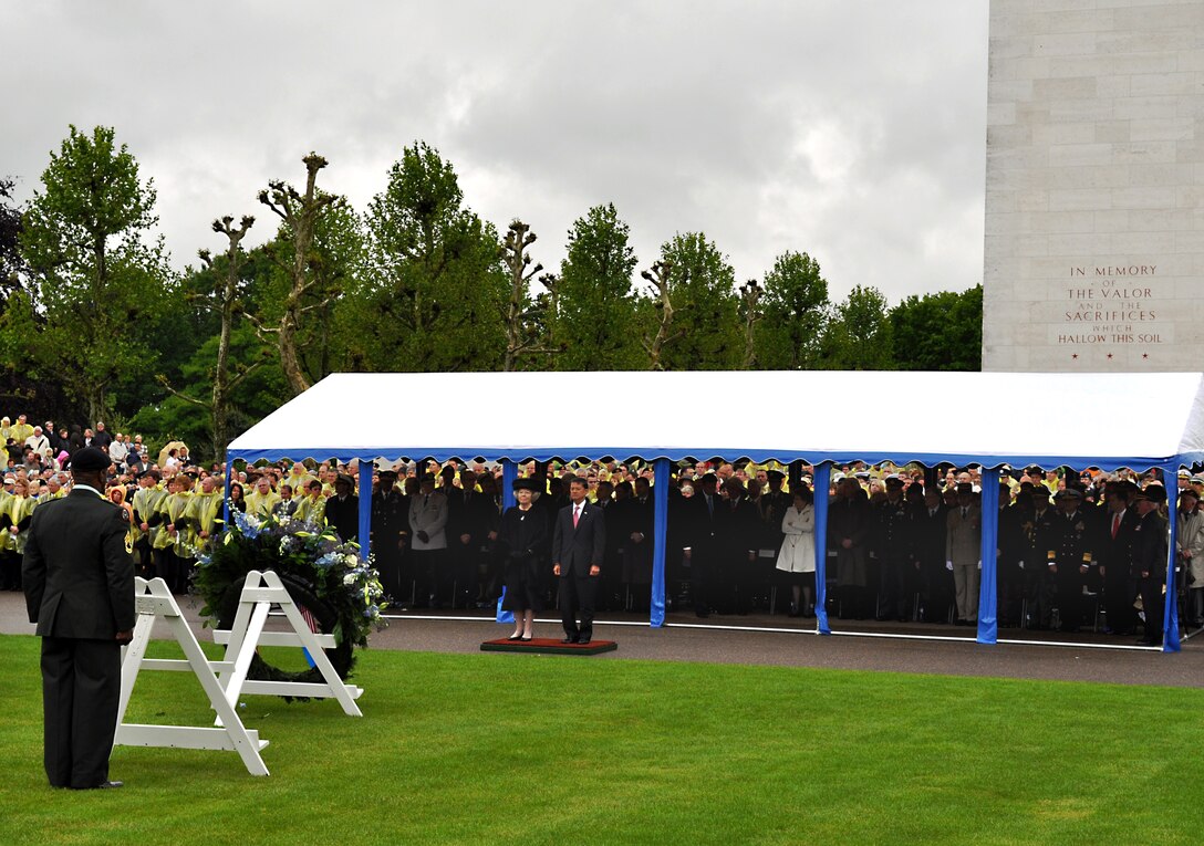 Her Majesty Queen Beatrix, Queen of the Netherlands, stands with U.S. Veterans Affairs Secretary Eric K. Shinseki in solemn remembrance during the 66th annual observation of the American Memorial Day at the Netherlands American Cemetery and Memorial in Margraten, Netherlands, May 30, 2010. Headquarters and Headquarters Detachment USAG Schinnen Sgt. 1st Class Axel Fontenot led a multi-national cadre of servicemembers from all branches of the military in laying more than 65 wreathes where 8,301 American are buried. Local Dutch citizens have adopted every gravesite at the cemetery, and often, this role is handed down from generation to generation. 