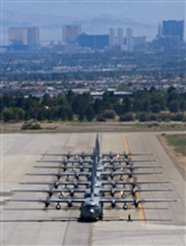 A line of C-130 Hercules aircraft taxis during the U.S. Air Force Weapons School Mobility Air Forces Exercise at Nellis Air Force Base, Nev., on May 19, 2010.  Approximately 40 C-17 Globemaster and C-130 Hercules aircraft assembled in aerial formations over the Nevada Test and Training Range to conduct air and ground operations as part of the biannual exercise.  