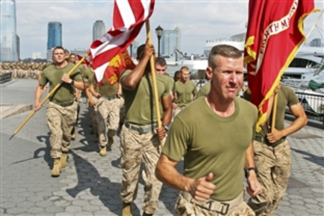 About 400 Marines, sailors, Coast Guardsmen and New York's police and firefighters ran through downtown Manhattan to honor 9/11 victims and America's fallen heroes, New York, June 1, 2010. More than 3,000 of the military members are in the area participating in community outreach events and equipment demonstrations for Fleet Week, which runs through June 2. This is the 26th year the city has hosted the event.