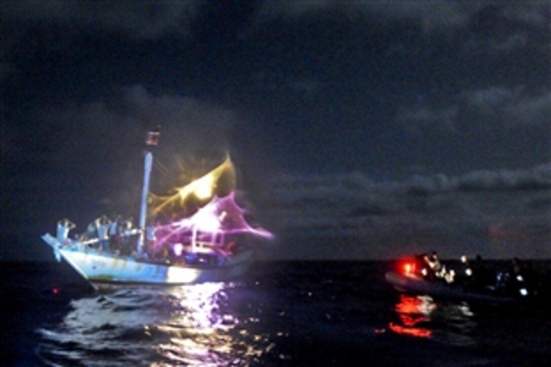 Members of the visit, board, search and seizure team from USS San Jacinto conduct a nighttime boarding in the Gulf of Aden, May 26, 2010. The San Jacinto is part of Combined Task Force 151, a multinational task force established to conduct counterpiracy operations in the Gulf of Aden.