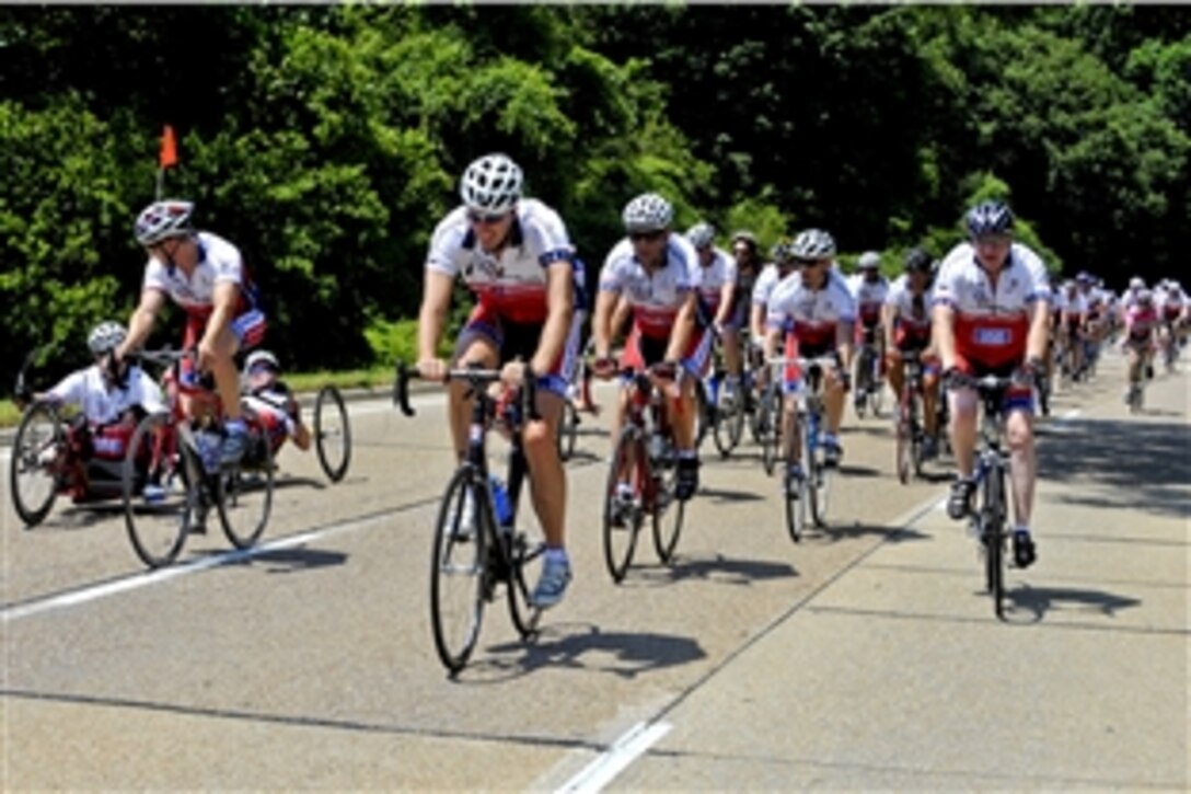 U.S. Navy Adm. Gary Roughead, chief of Naval Operations, and Army Chief of Staff Gen. George W. Casey Jr. ride with more than 200 injured veterans and supporters in the first 50 miles of the six-day, 350-mile "Ride 2 Recovery Memorial Challenge" in Washington, D.C., May 31, 2010.
