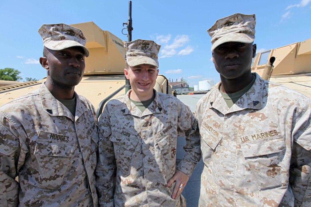 Corporal Desmond D. Hodges, Cpl. Tim D. Ross, and Cpl. Dylan E. Howerton, (left to right) motor transportation operators with Training and Operations office, 2nd Marine Division, take a break before prepping  humvees for future training sessions April 11. Ross a Forest Grove, Ore., native, has deployed to Afghanistan and currently trains Marines how to operate various vehicles including the Humvee.