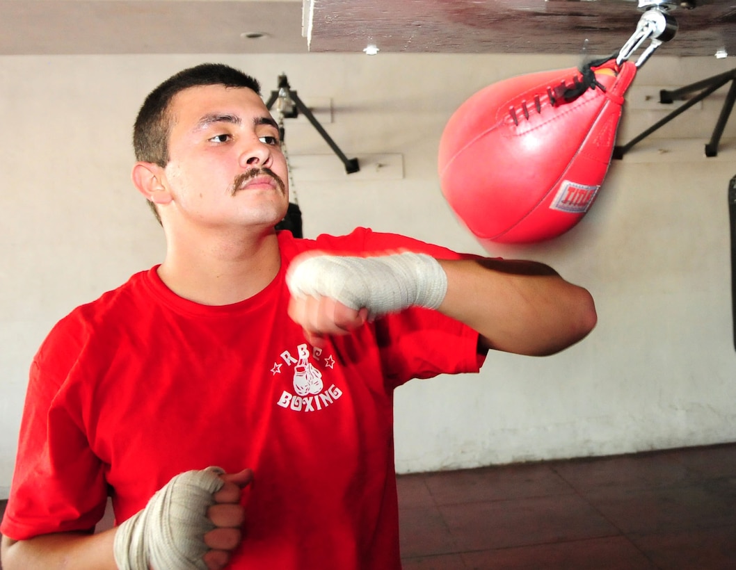 PHOENIX - With aspirations to join the All-Marine Boxing Team, Harland Wilson Aguirre-Munoz works on the speed bag to improve his physical fitness before reporting to recruit training in January 2011 . Aguirre-Munoz, 19, is a future U.S. Marine from Phoenix. (U.S. Marine Corps photo by Cpl. Fredrick J. Coleman)