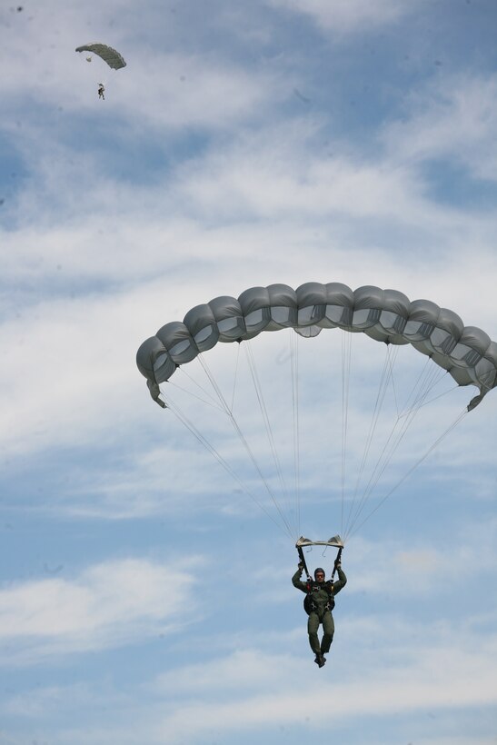 Romanian paratroopers float to the ground over Campia Turzii, Romania, June 2. A pair of KC-130T Hercules aircraft from Marine Aerial Refueler Transport Squadron 234 and VMGR-452, provided support for about 75 Romanian airborne troops, June 2-3.