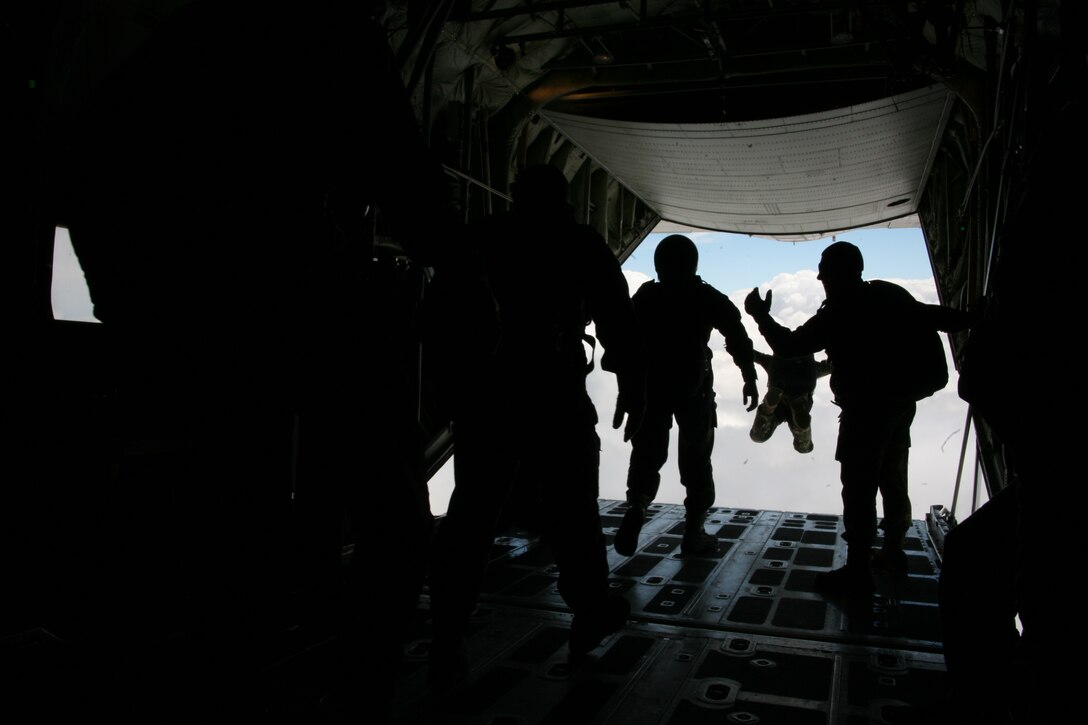Romanian paratroopers line the back of a U.S. Marine Corps KC-130T to conduct a military free fall jump, June 2. Romanian airborne troops performed both static-line and military free fall jumps, June 2-3, using a pair of KC-130T Hercules aircraft from Marine Aerial Refueler Transport Squadron 234 and VMGR-452, as their platform.