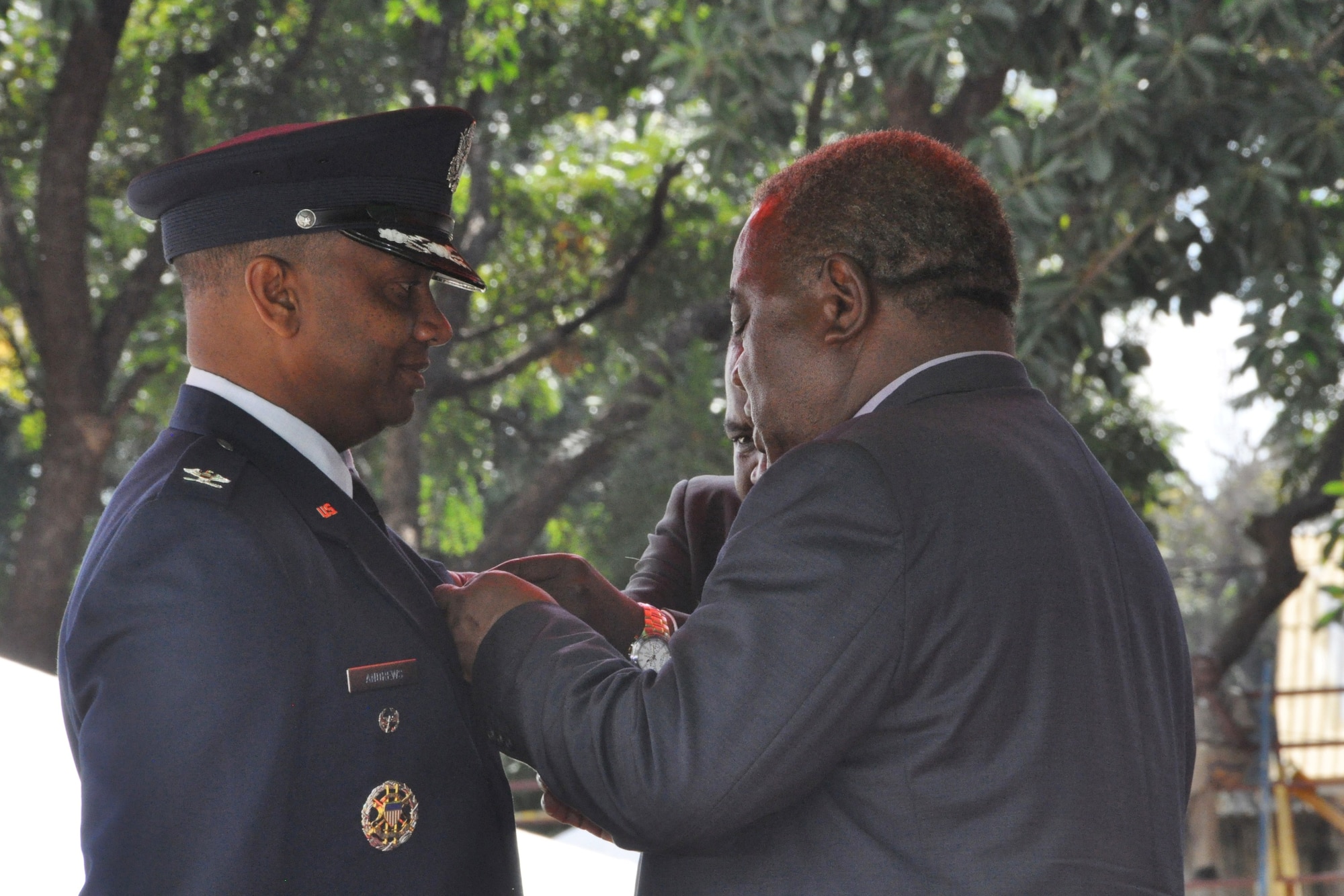 Zambian President Rupiah Banda awards Col. Keith Andrews the President's Medal of Gallantry May 25 for the rescue of two Zambian women in the Zambezi River at Victoria Falls a year earlier. Andrews was visiting the area as part of a U.S. Air Force Air War College regional study program tour. (Photo by Staff Sgt. Amanda McCarty, U.S. Africa Command)