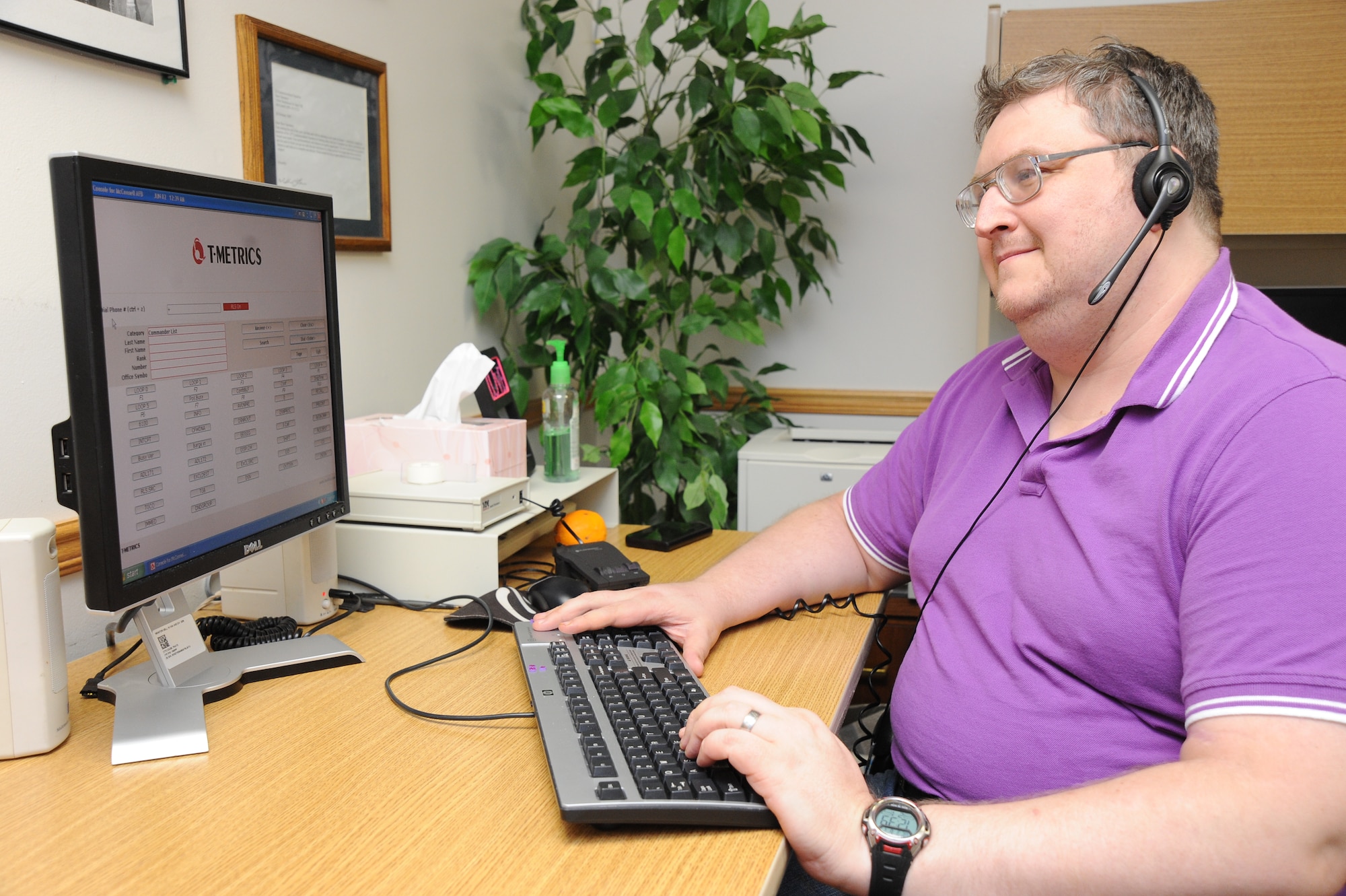 Andrew Doris, 22nd Communications Squadron switchboard operator, researches a number for a caller, June 2, 2010, McConnell Air Force Base, Kan.  McConnell’s switchboard operators answer more than 800 calls a day.  The operators also connect official international and morale calls for servicemembers, deployed personnel and their families.  (U.S. Air Force photo/Tech. Sgt. Chyrece Campbell)