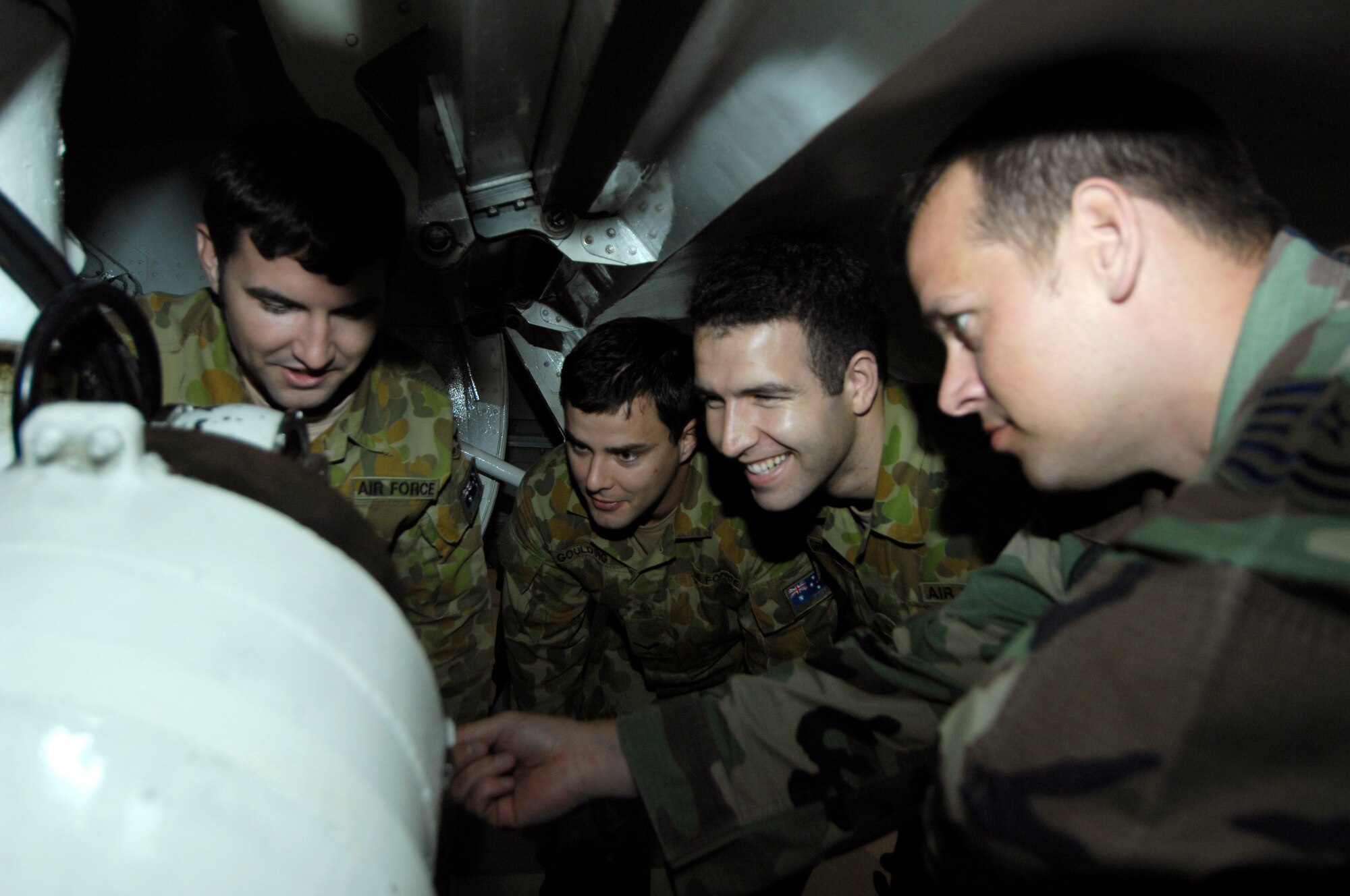U.S. Air Force Tech. Sgt. Bryan Doughty instructs Royal Australian Airmen during a three month course on C-17 maintenance at Joint Base Charleston, S.C., June 1, 2010. The complexity of the training required for the Australian Airmen is more than twice the length of the average technical school for U.S. Air Force Airmen. Sergeant Doughty is a training instructor with the 373rd Training Squadron, Detachment 5. (U.S. Air Force/Airman 1st Class Lauren Main)